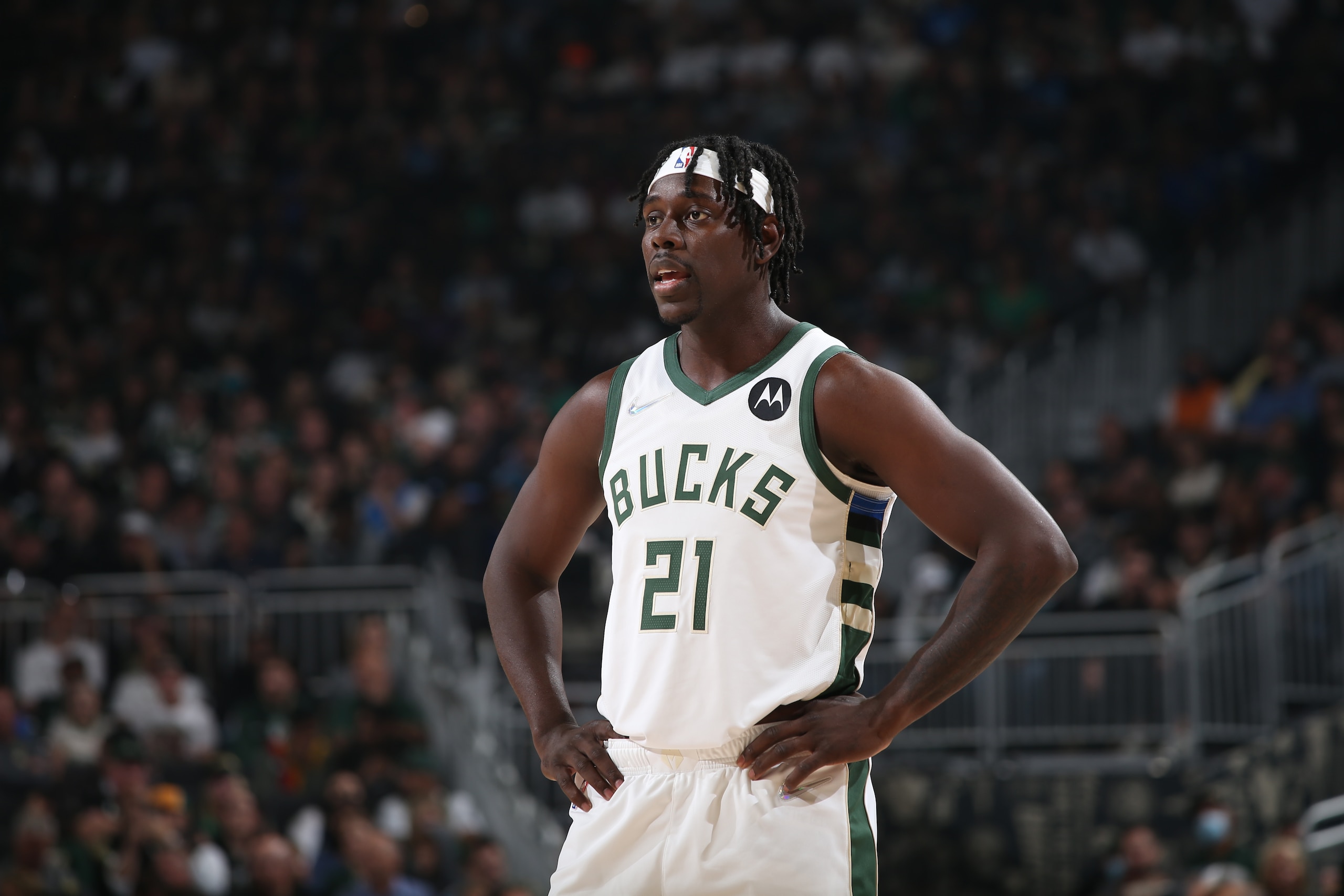 MILWAUKEE, WI - OCTOBER 19: Jrue Holiday #21 of the Milwaukee Bucks looks on during the game against the Brooklyn Nets on October 19, 2021 at the Fiserv Forum Center in Milwaukee, Wisconsin. NOTE TO USER: User expressly acknowledges and agrees that, by downloading and or using this Photograph, user is consenting to the terms and conditions of the Getty Images License Agreement. Mandatory Copyright Notice: Copyright 2021 NBAE (Photo by Gary Dineen/NBAE via Getty Images).