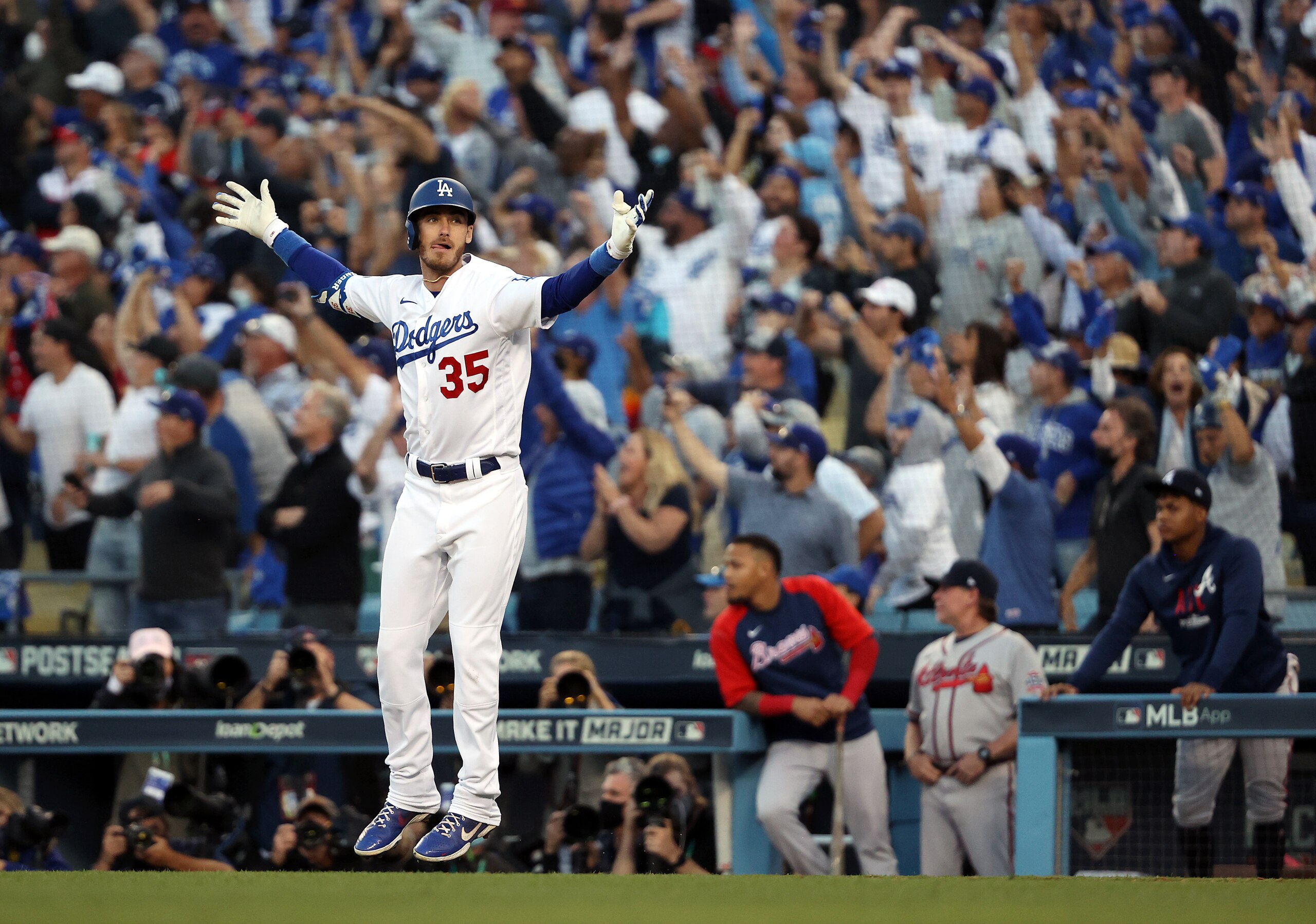 LOS ANGELES, CALIFORNIA - OCTOBER 19:  Cody Bellinger #35 of the Los Angeles Dodgers reacts as he rounds the bases after hitting a 3-run home run during the 8th inning of Game 3 of the National League Championship Series against the Atlanta Braves at Dodger Stadium on October 19, 2021 in Los Angeles, California. (Photo by Sean M. Haffey/Getty Images)