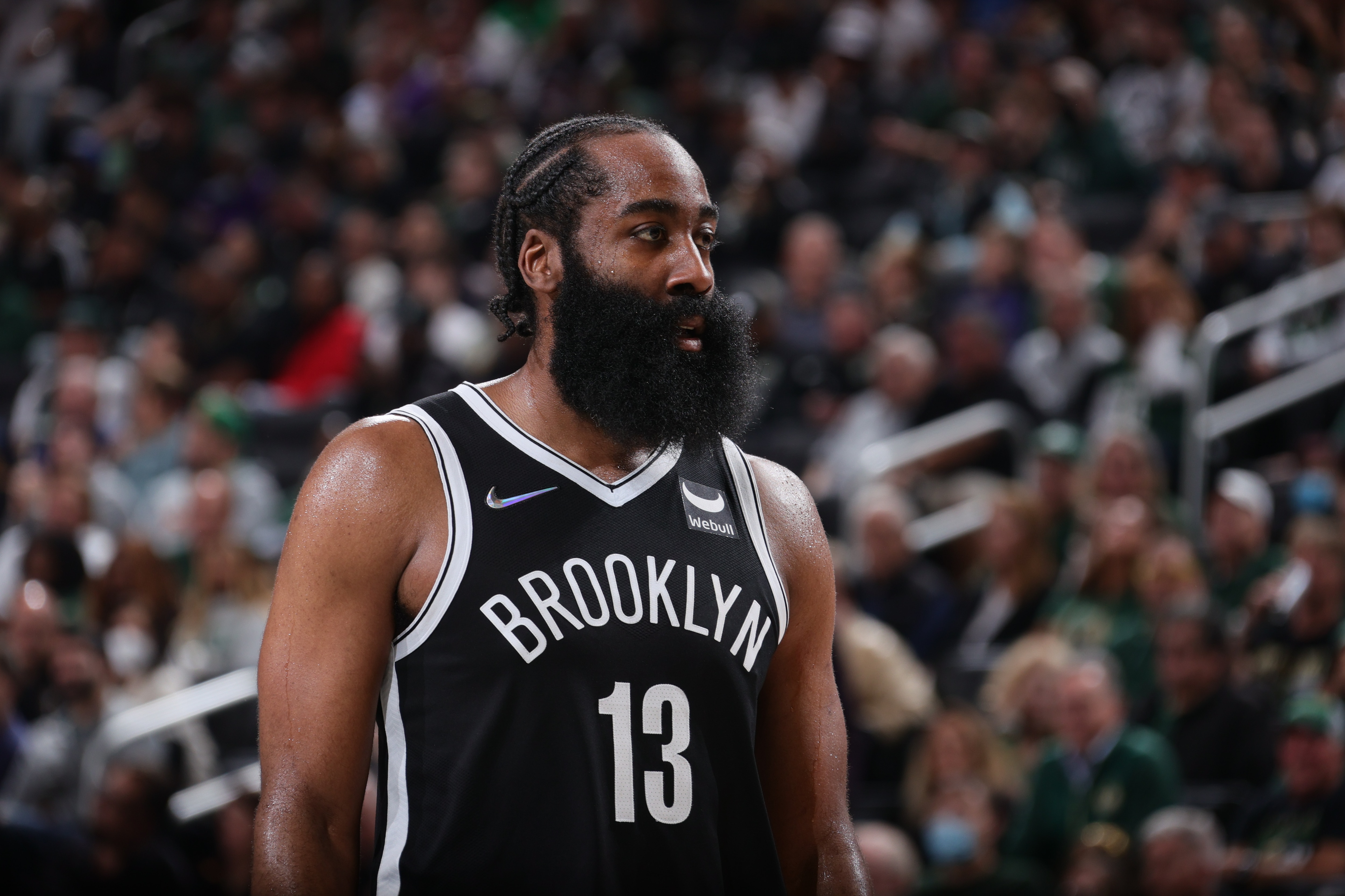 MILWAUKEE, WI - OCTOBER 19: James Harden #13 of the Brooklyn Nets looks on during the game against the Milwaukee Bucks on October 19, 2021 at the Fiserv Forum Center in Milwaukee, Wisconsin. NOTE TO USER: User expressly acknowledges and agrees that, by downloading and or using this Photograph, user is consenting to the terms and conditions of the Getty Images License Agreement. Mandatory Copyright Notice: Copyright 2021 NBAE (Photo by Nathaniel S. Butler/NBAE via Getty Images).