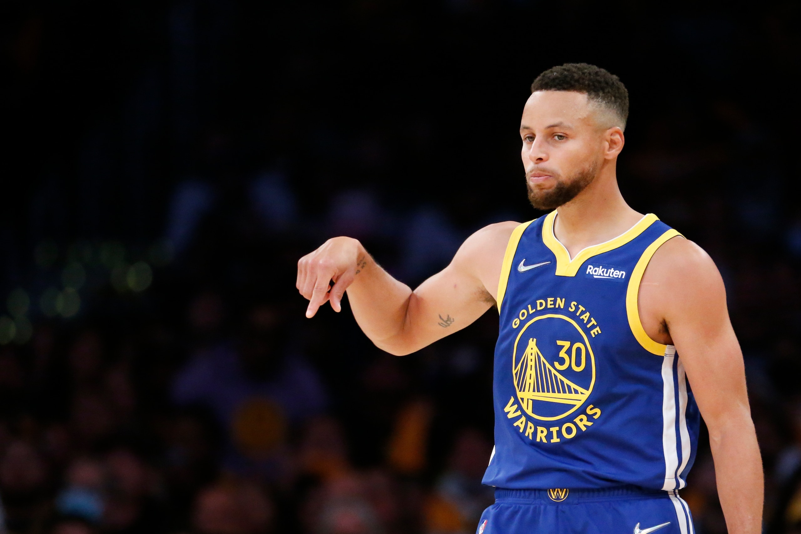 Golden State Warriors guard Stephen Curry (30) gestures against the Los Angeles Lakers during the second half of an NBA basketball game in Los Angeles, Tuesday, Oct. 19, 2021. The Warriors won 121-114. (AP Photo/Ringo H.W. Chiu)