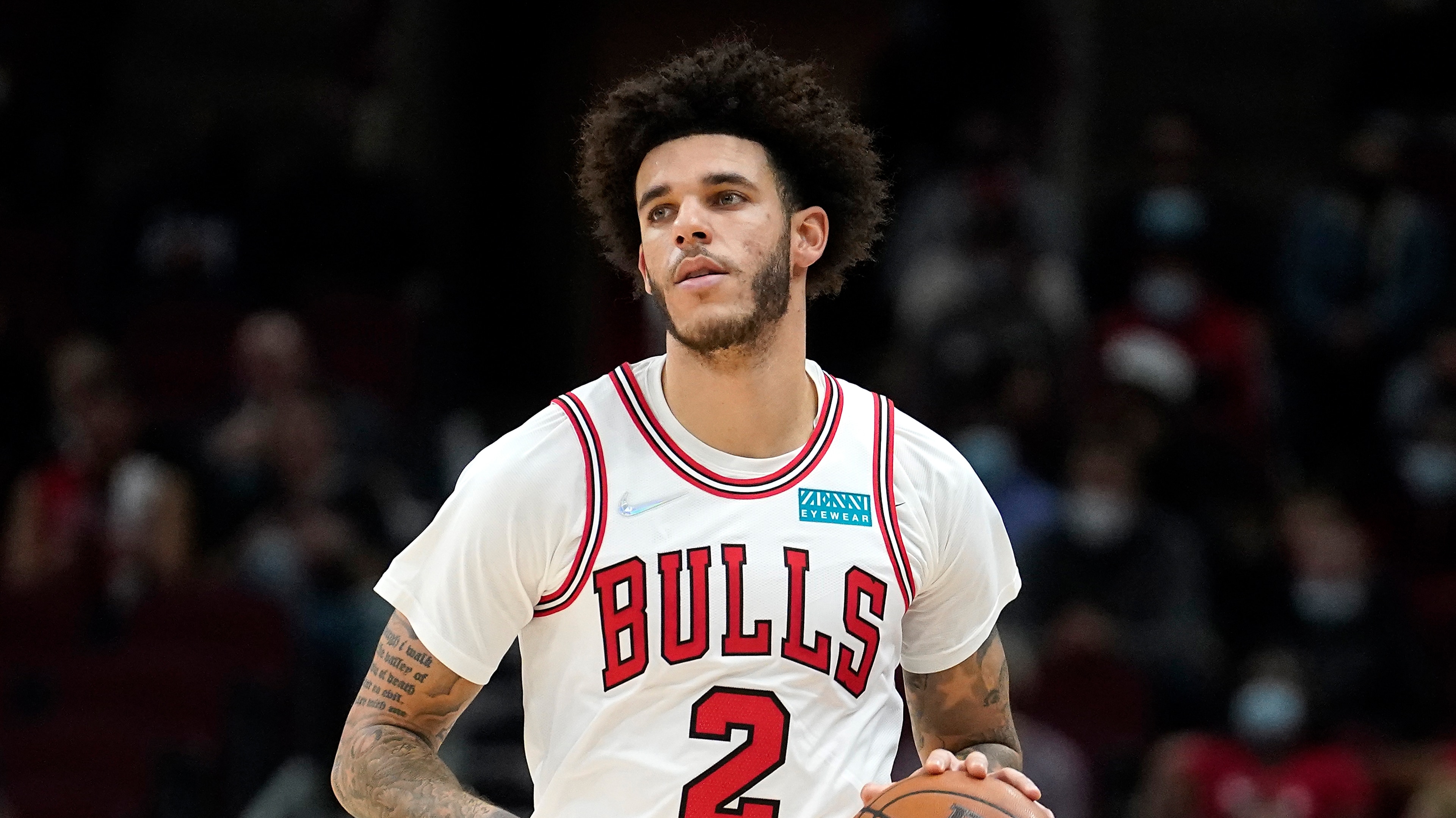 Chicago Bulls guard Lonzo Ball brings the ball up court during the first half of an NBA preseason basketball game against the Memphis Grizzlies Friday, Oct. 15, 2021, in Chicago. (AP Photo/Charles Rex Arbogast)