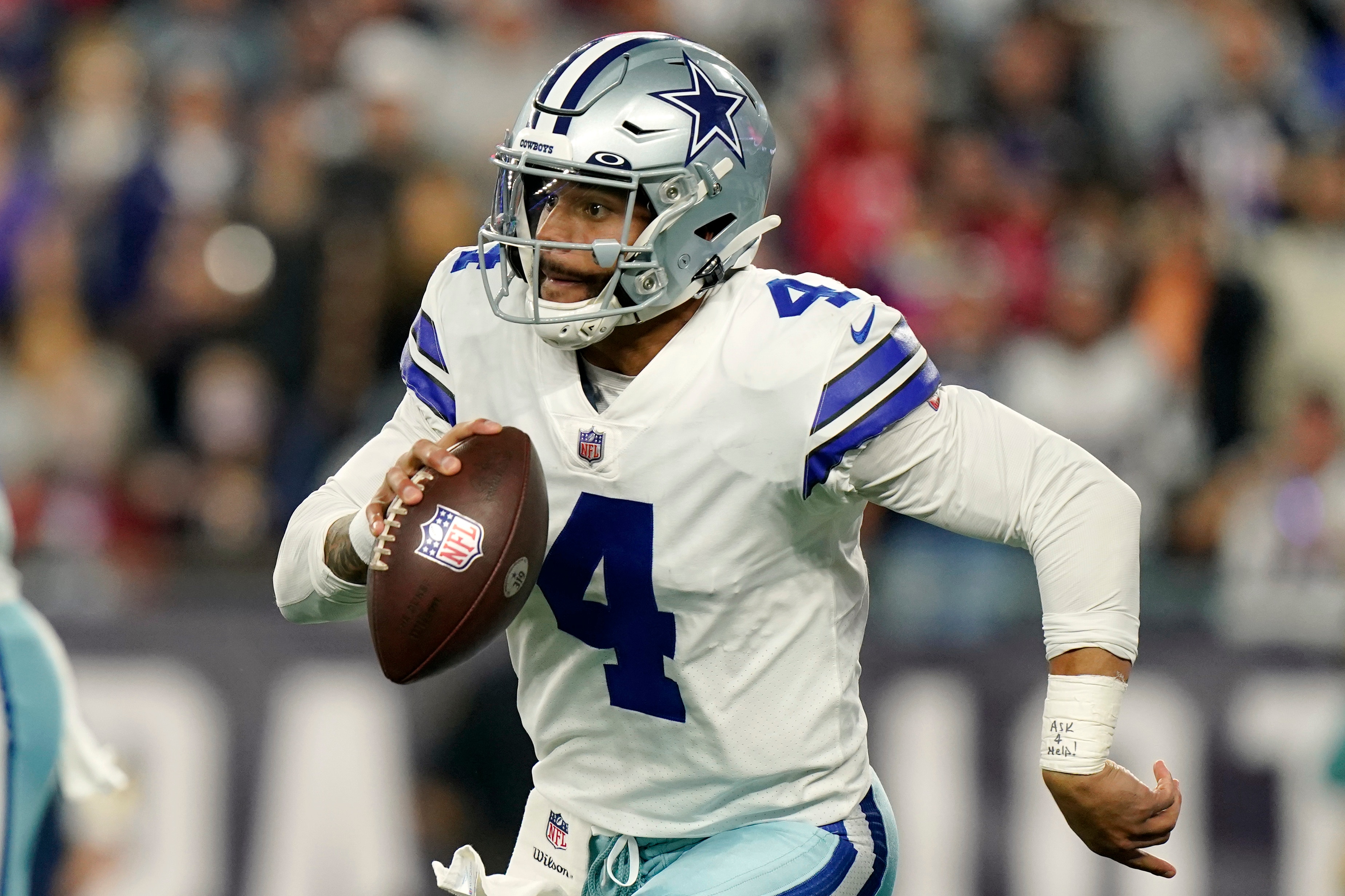 Dallas Cowboys quarterback Dak Prescott runs with the ball during the second half of an NFL football game against the New England Patriots, Sunday, Oct. 17, 2021, in Foxborough, Mass. (AP Photo/Steven Senne)