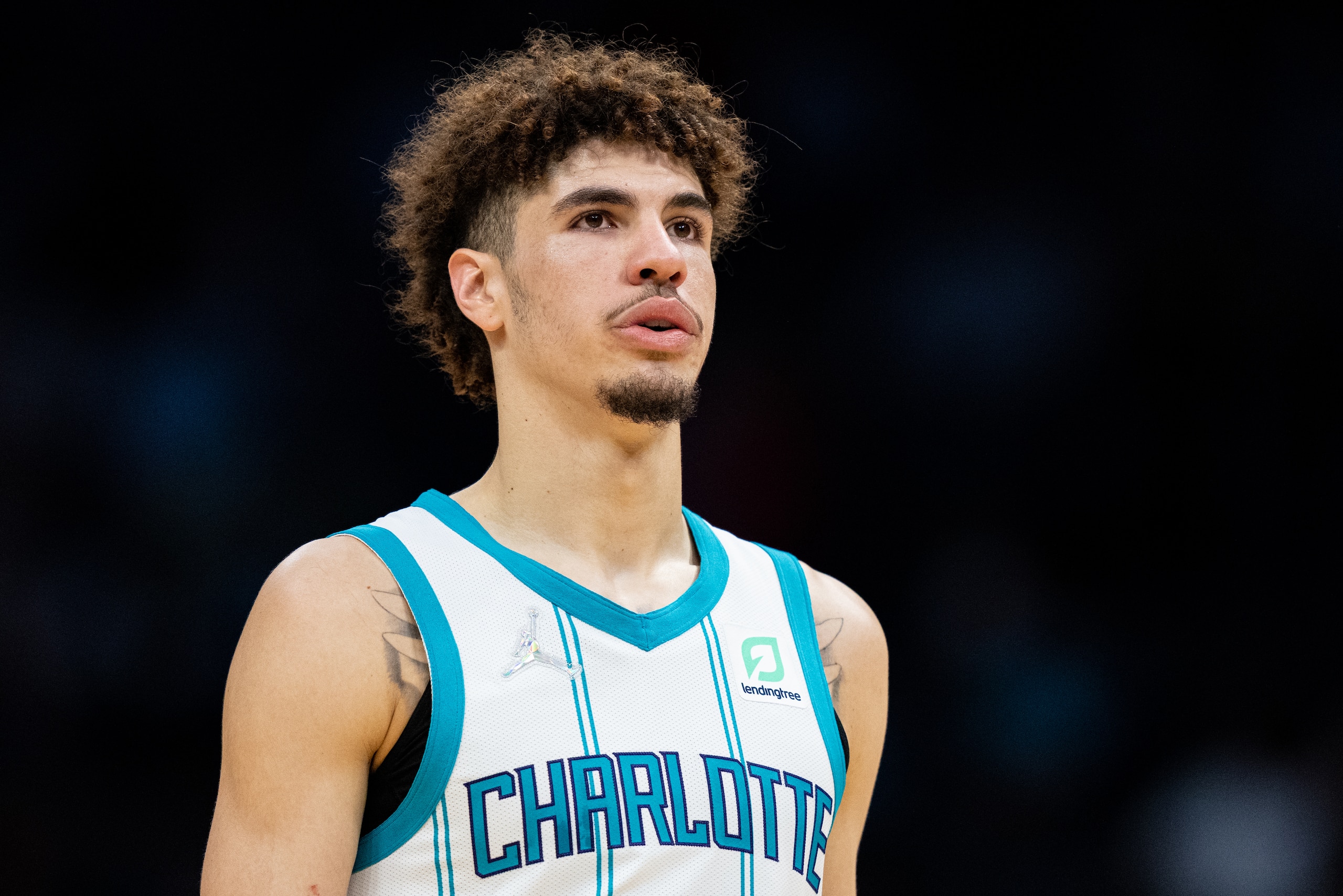CHARLOTTE, NORTH CAROLINA - OCTOBER 13: LaMelo Ball #2 of the Charlotte Hornets looks on against the Dallas Mavericks during their game at Spectrum Center on October 13, 2021 in Charlotte, North Carolina. NOTE TO USER: User expressly acknowledges and agrees that, by downloading and or using this photograph, User is consenting to the terms and conditions of the Getty Images License Agreement. (Photo by Jacob Kupferman/Getty Images)