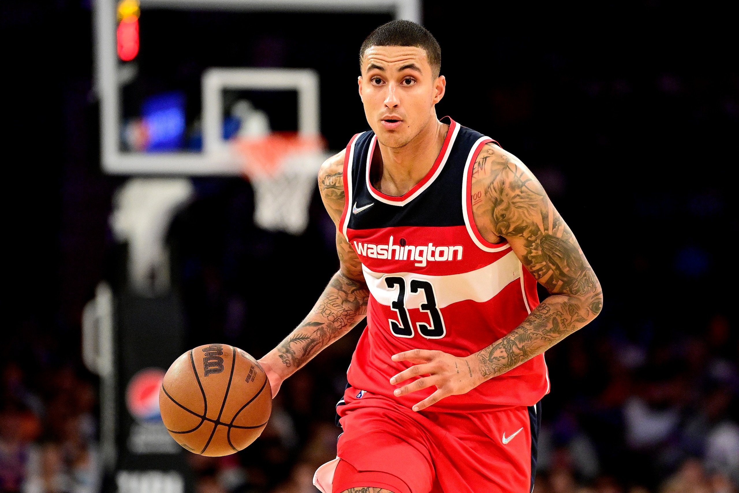 NEW YORK, NEW YORK - OCTOBER 15:  Kyle Kuzma #33 of the Washington Wizards handles the ball against the New York Knicks during a preseason game at Madison Square Garden on October 15, 2021 in New York City. NOTE TO USER: User expressly acknowledges and agrees that, by downloading and or using this photograph, user is consenting to the terms and conditions of the Getty Images License Agreement. (Photo by Steven Ryan/Getty Images)