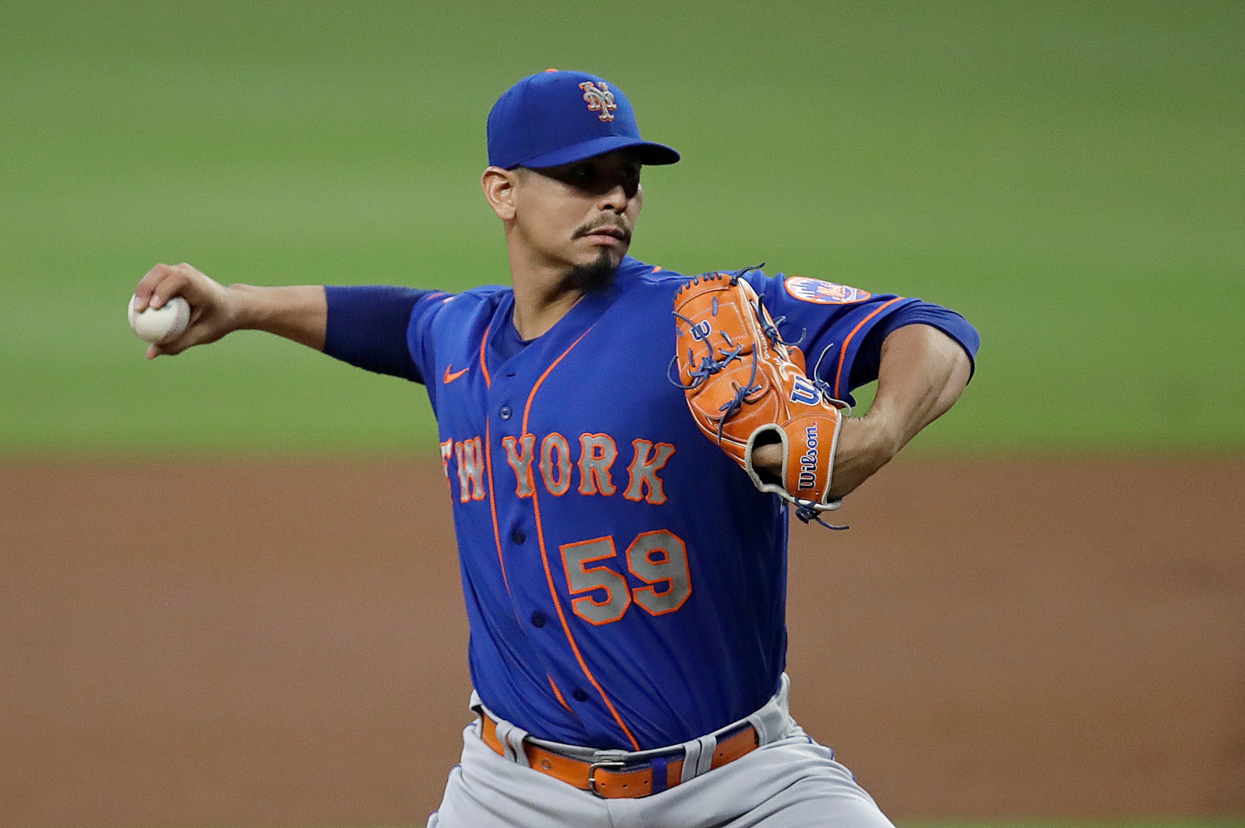 New York Mets pitcher Carlos Carrasco works against the Atlanta Braves in the first inning of a baseball game Saturday, Oct. 2, 2021, in Atlanta. (AP Photo/Ben Margot)