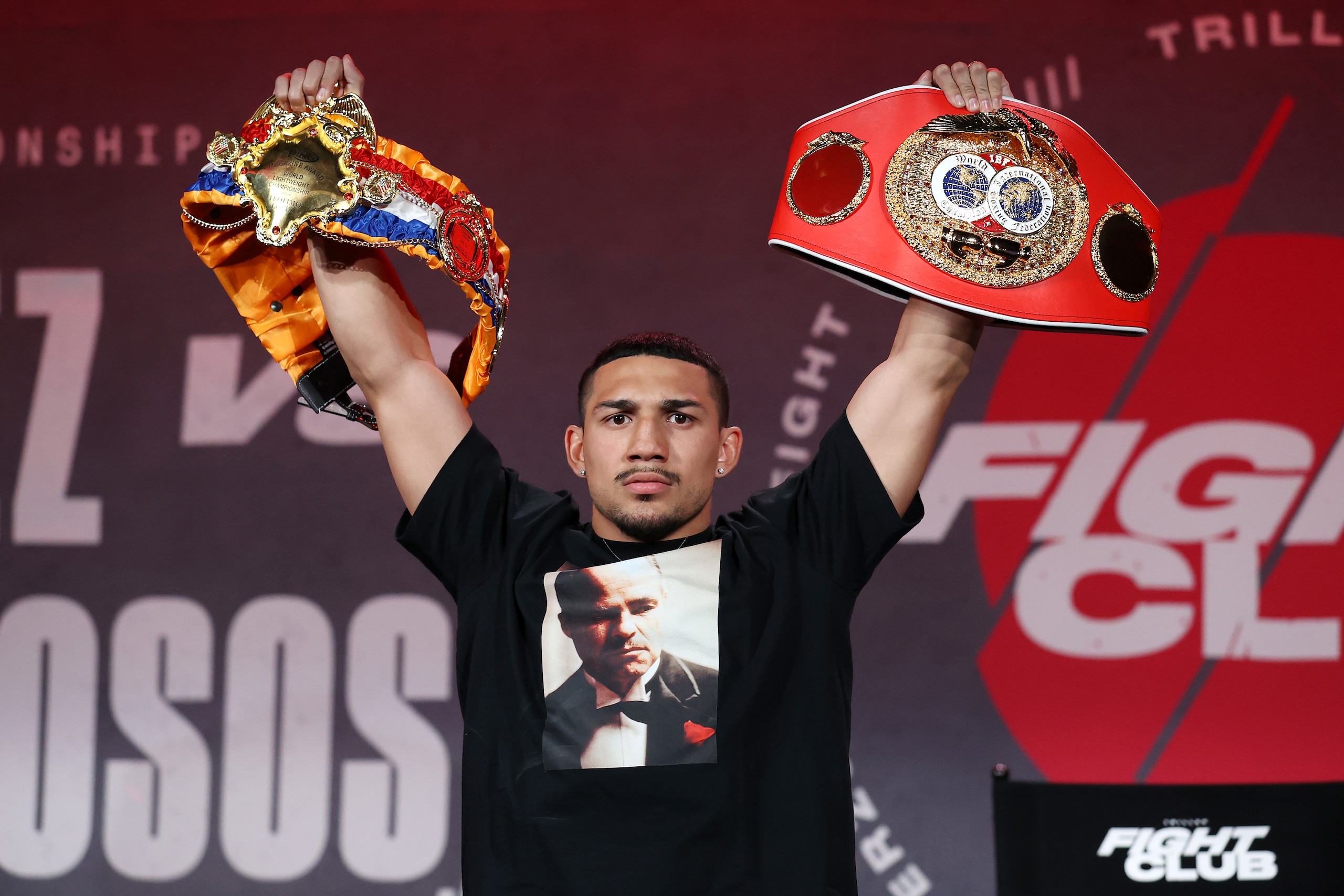 ATLANTA, GEORGIA - APRIL 16: Teofimo Lopez poses with his championship belts during a press conference for Triller Fight Club at Mercedes-Benz Stadium on April 16, 2021 in Atlanta, Georgia ahead of his June 5 lightweight title fight against George Kambosos Jr. (Photo by Al Bello/Getty Images for Triller)