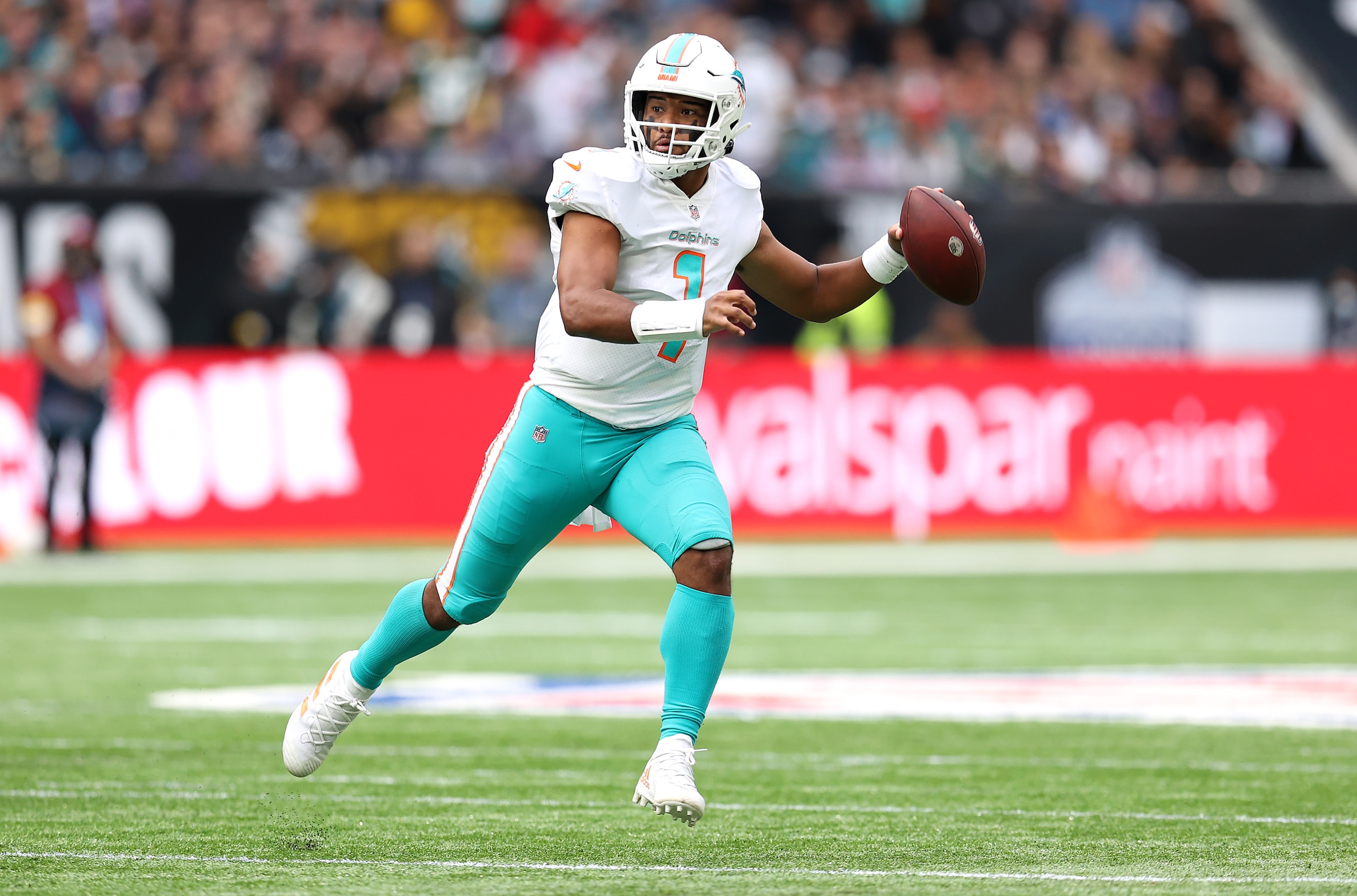 LONDON, ENGLAND - OCTOBER 17: Tua Tagovailoa #1 of the Miami Dolphins throws the ball during the NFL London 2021 match between Miami Dolphins and Jacksonville Jaguars at Tottenham Hotspur Stadium on October 17, 2021 in London, England. (Photo by Alex Pantling/Getty Images)
