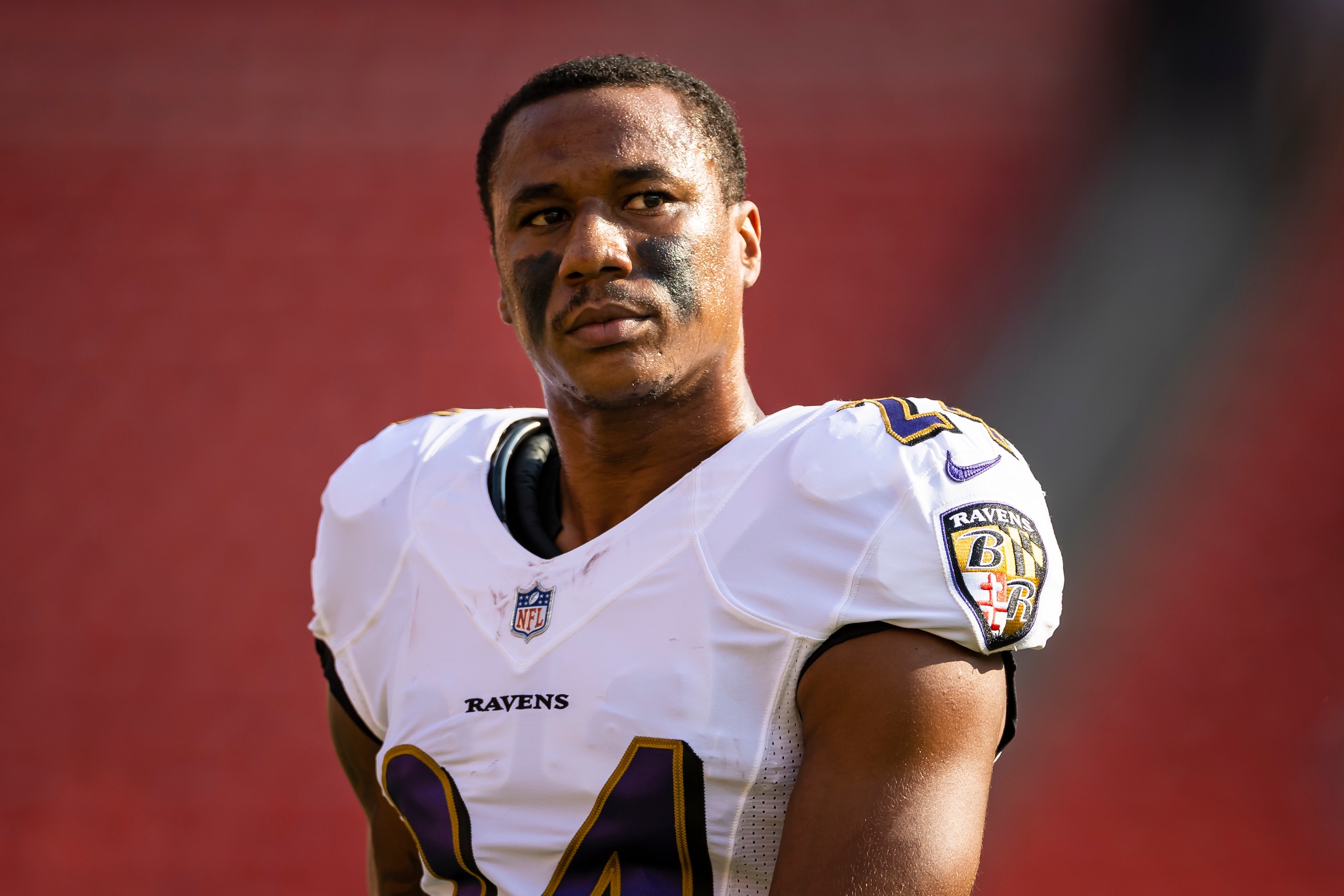LANDOVER, MD - AUGUST 28: Marcus Peters #24 of the Baltimore Ravens warms up before the preseason game against the Washington Football Team at FedExField on August 28, 2021 in Landover, Maryland. (Photo by Scott Taetsch/Getty Images)