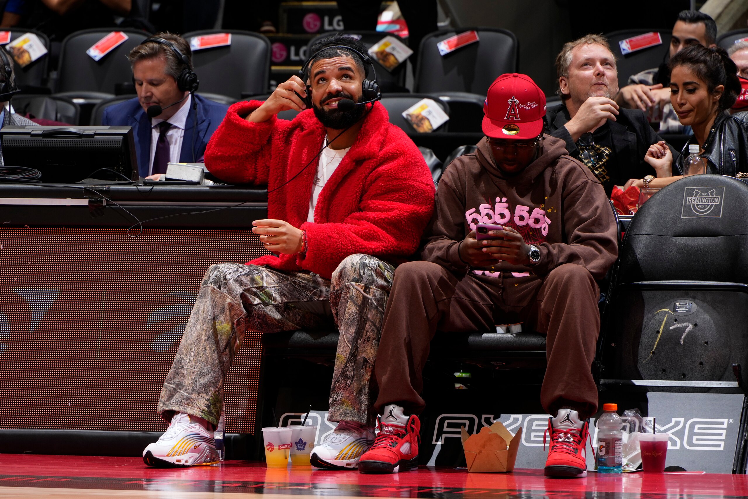 TORONTO, CANADA - OCTOBER 11: Rapper Drake attends the Toronto Raptors preseason game against the Houston Rockets on October 11, 2021 at the Scotiabank Arena in Toronto, Ontario, Canada.  NOTE TO USER: User expressly acknowledges and agrees that, by downloading and or using this Photograph, user is consenting to the terms and conditions of the Getty Images License Agreement.  Mandatory Copyright Notice: Copyright 2021 NBAE (Photo by Mark Blinch/NBAE via Getty Images)