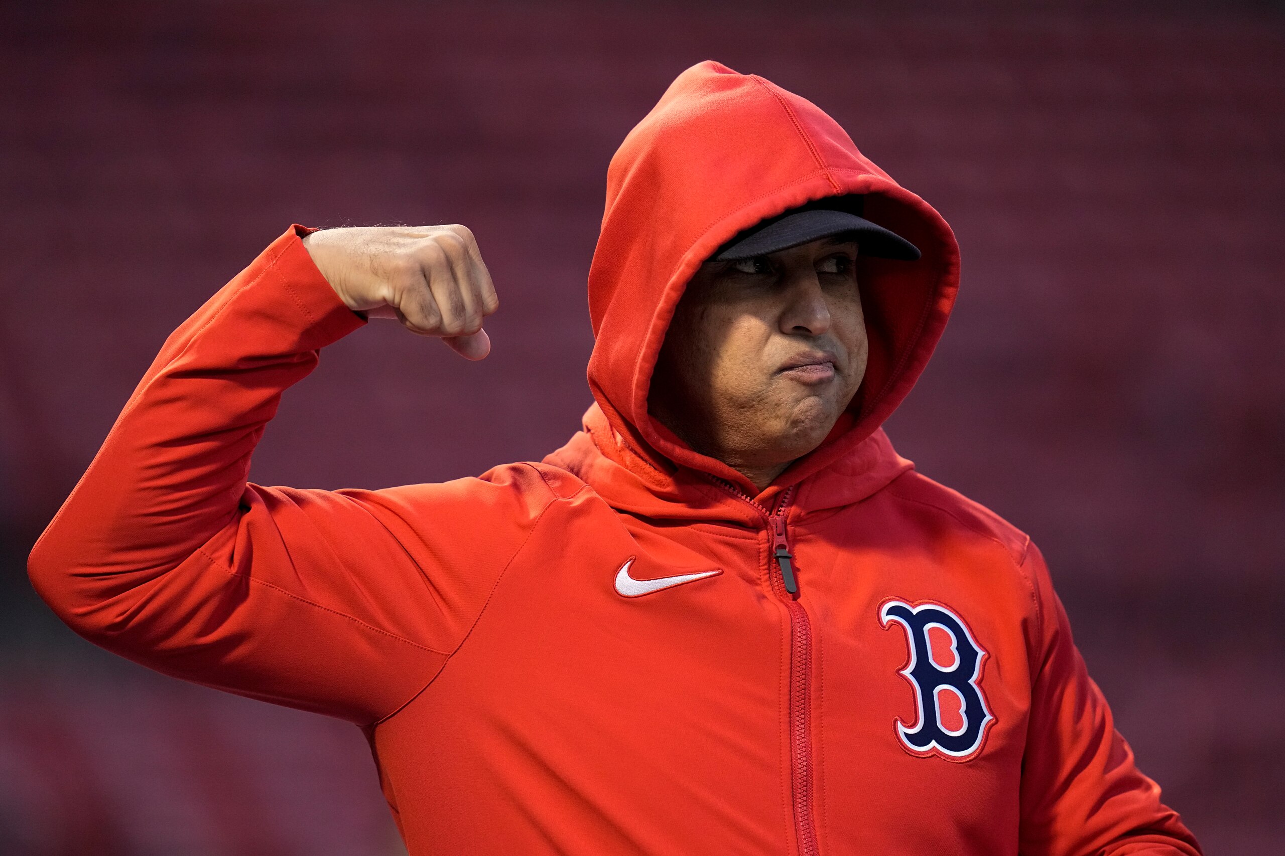 Boston Red Sox manager Alex Cora gestures during batting practice before Game 4 of baseball's American League Championship Series against the Houston Astros Tuesday, Oct. 19, 2021, in Boston. (AP Photo/Charles Krupa)