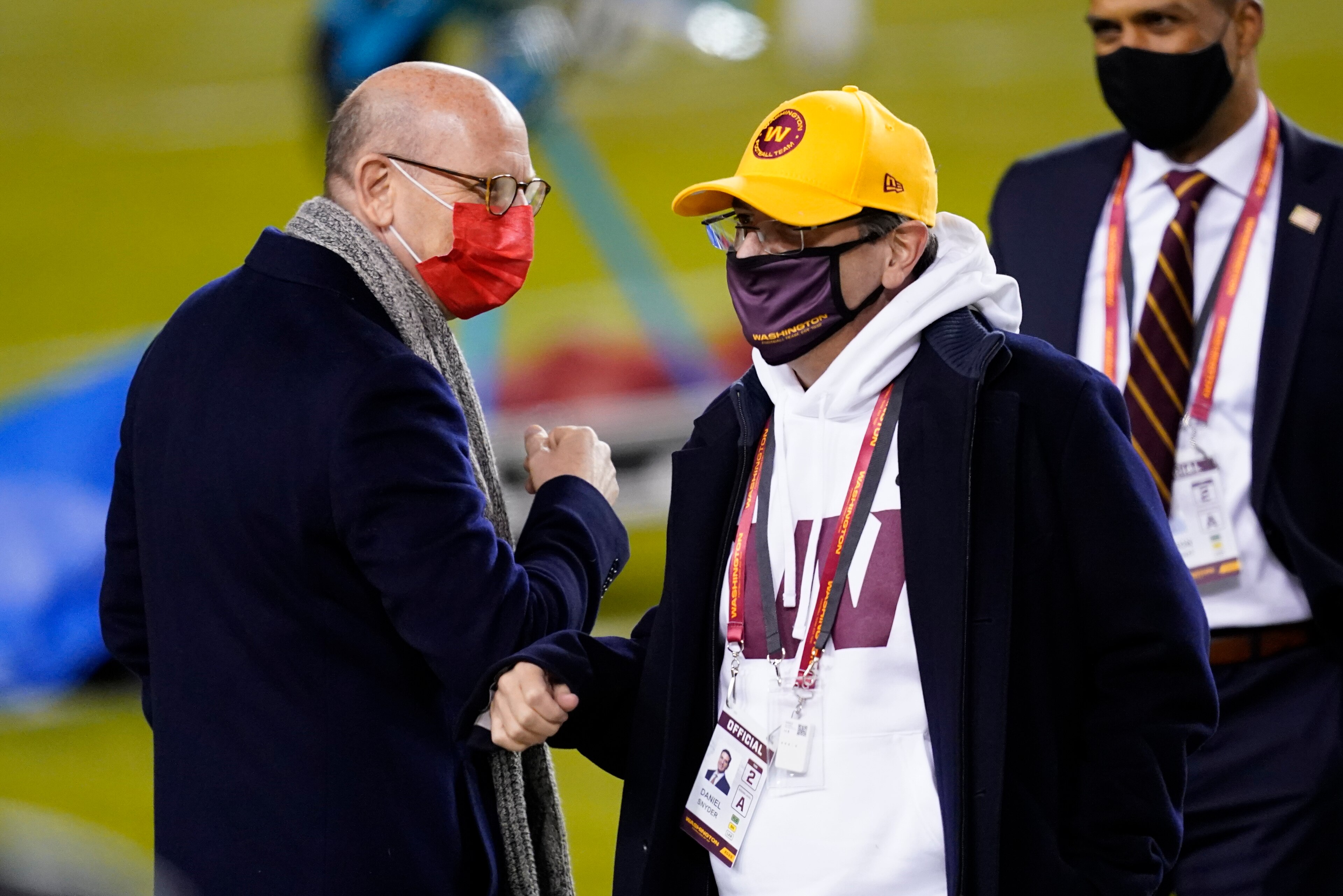 Tampa Bay Buccaneers owner Joel Glazer, left, talks with Washington Football Team owner Daniel Snyder, right, before an NFL wild-card playoff football game Saturday, Jan. 9, 2021, in Landover, Md. (AP Photo/Andrew Harnik) Tampa Bay Buccaneers owner Joel Glazer, left, talks with Washington Football Team owner Daniel Snyder, right, before an NFL wild-card playoff football game Saturday, Jan. 9, 2021, in Landover, Md. (AP Photo/Andrew Harnik)