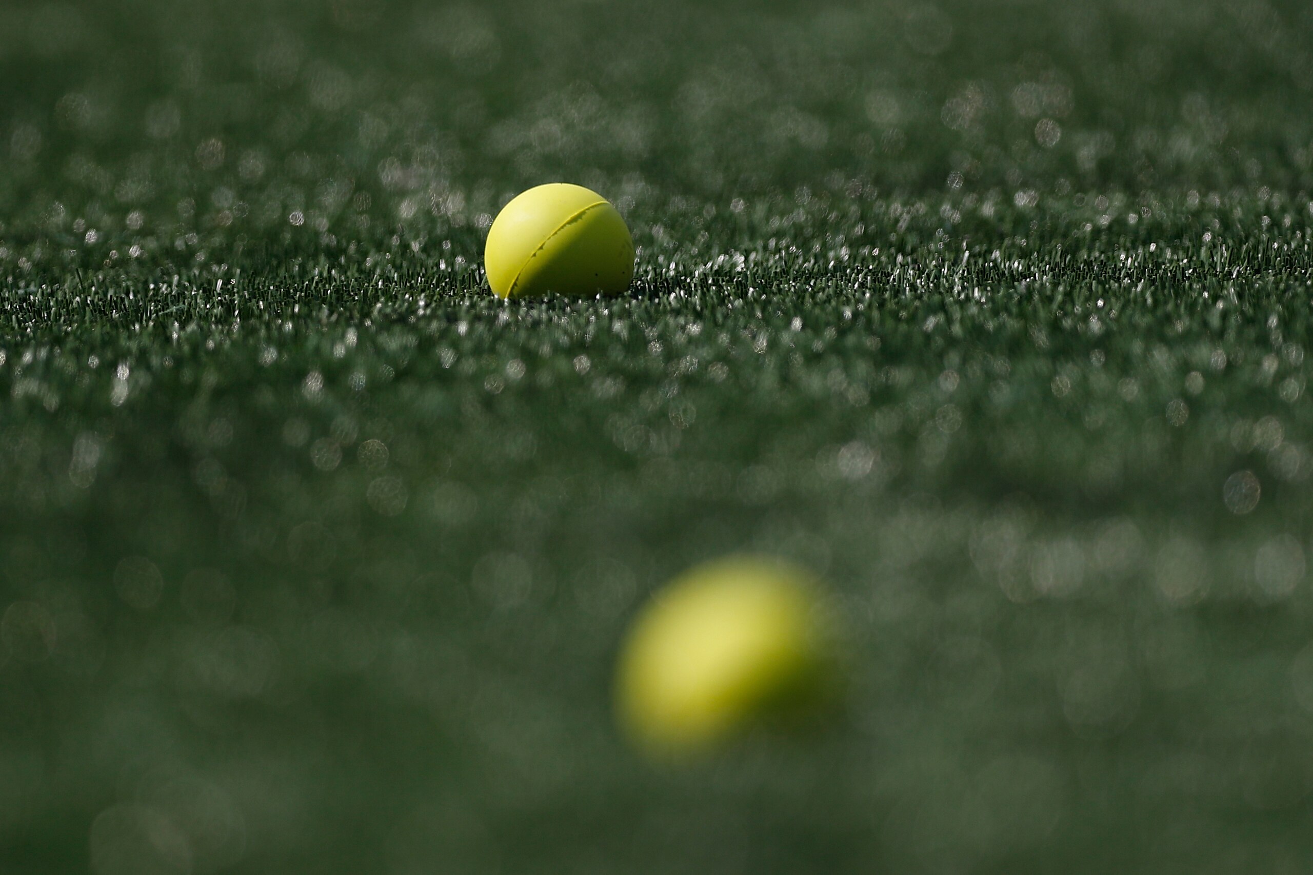 Lacrosse balls sit on the sidelines of the field before a Premier Lacrosse League game between the Redwoods and the Chrome, Sunday, June 6, 2021, in Foxborough, Mass. The Redwoods won 14-11. (AP Photo/Steve Luciano)