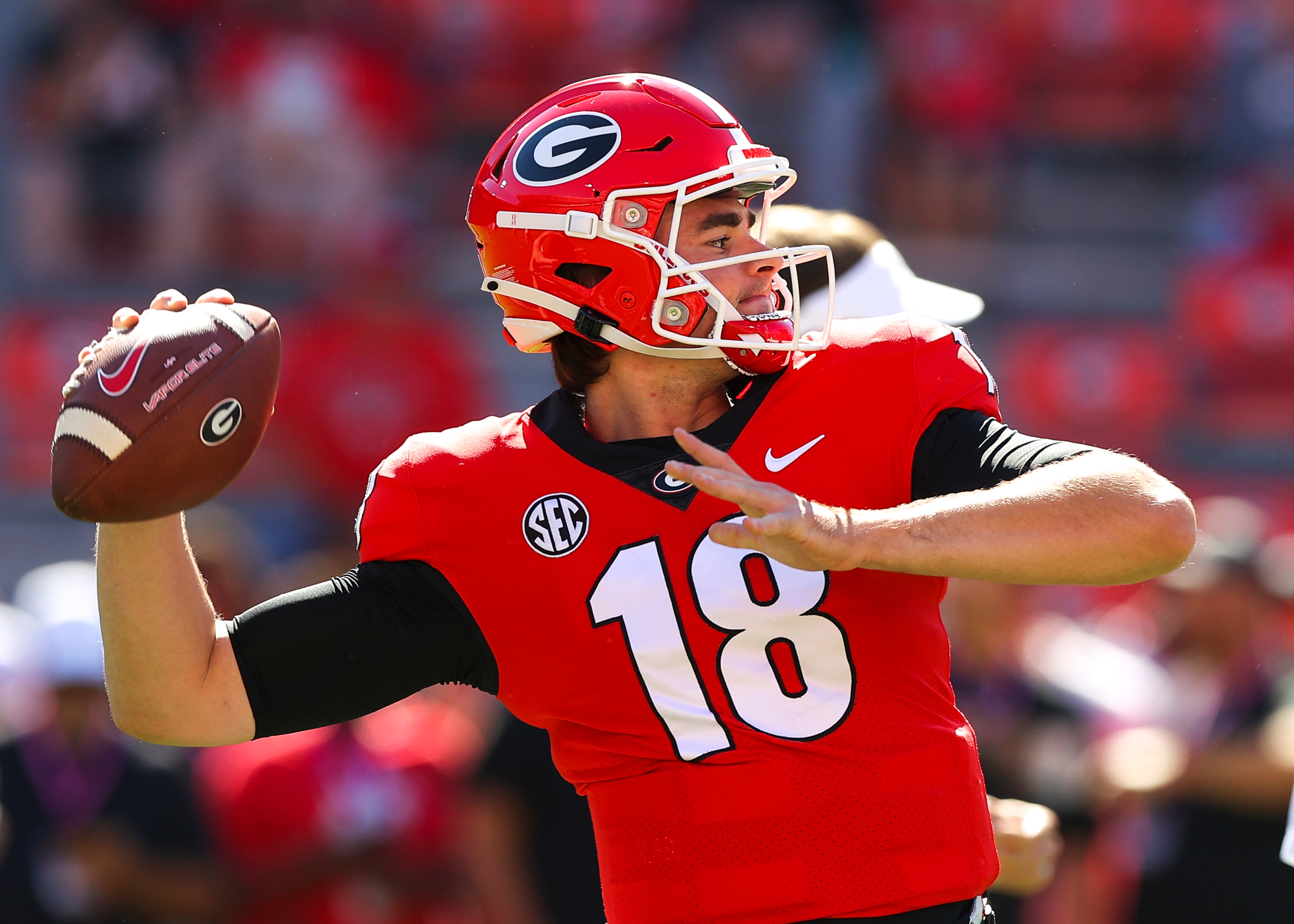 ATHENS, GA - OCTOBER 16: JT Daniels #18 of the Georgia Bulldogs warms up prior to the game against the Kentucky Wildcats at Sanford Stadium on October 16, 2021 in Athens, Georgia. (Photo by Todd Kirkland/Getty Images)