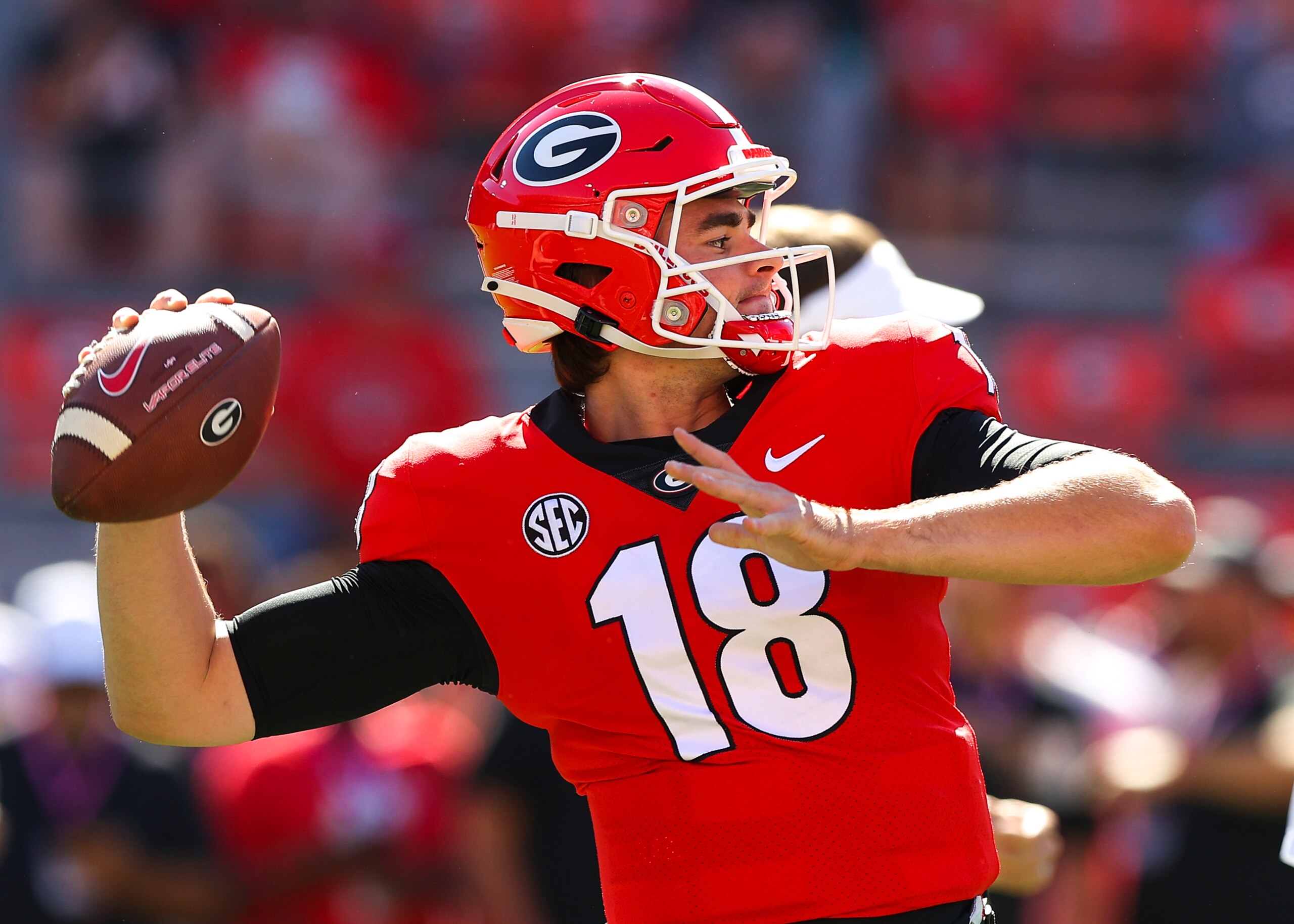 ATHENS, GA - OCTOBER 16: JT Daniels #18 of the Georgia Bulldogs warms up prior to the game against the Kentucky Wildcats at Sanford Stadium on October 16, 2021 in Athens, Georgia. (Photo by Todd Kirkland/Getty Images)