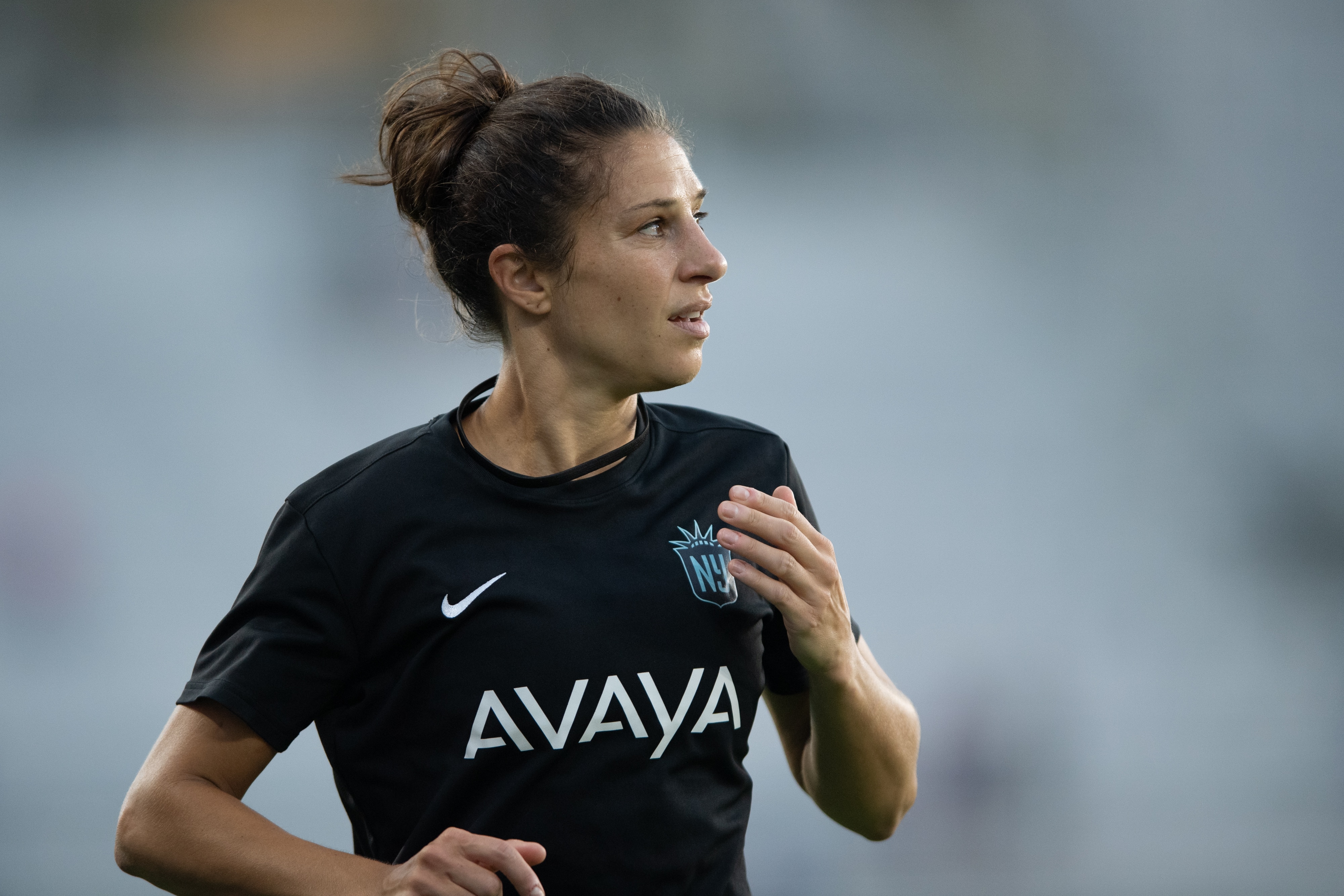 ORLANDO, FL - OCTOBER 9: Carli Lloyd #10 of Gotham FC runs off the field during the warmup before a game between NJ/NY Gotham City FC and Orlando Pride at Exploria Stadium on October 9, 2021 in Orlando, Florida. (Photo by Jeremy Reper/ISI Photos/Getty Images)