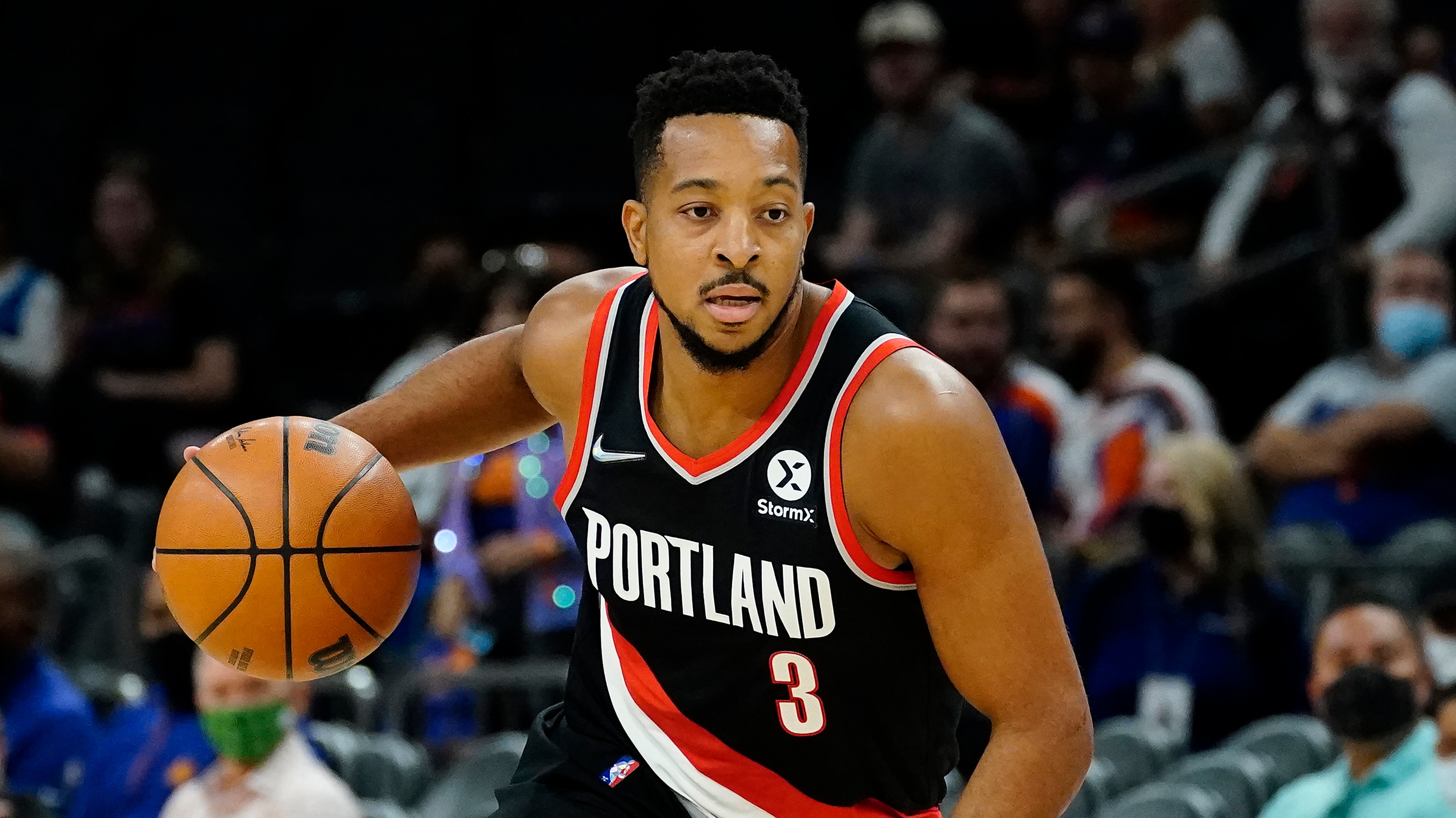 Portland Trail Blazers guard CJ McCollum (3) against the Phoenix Suns during the first half of a preseason NBA basketball game, Wednesday, Oct. 13, 2021, in Phoenix. (AP Photo/Matt York)