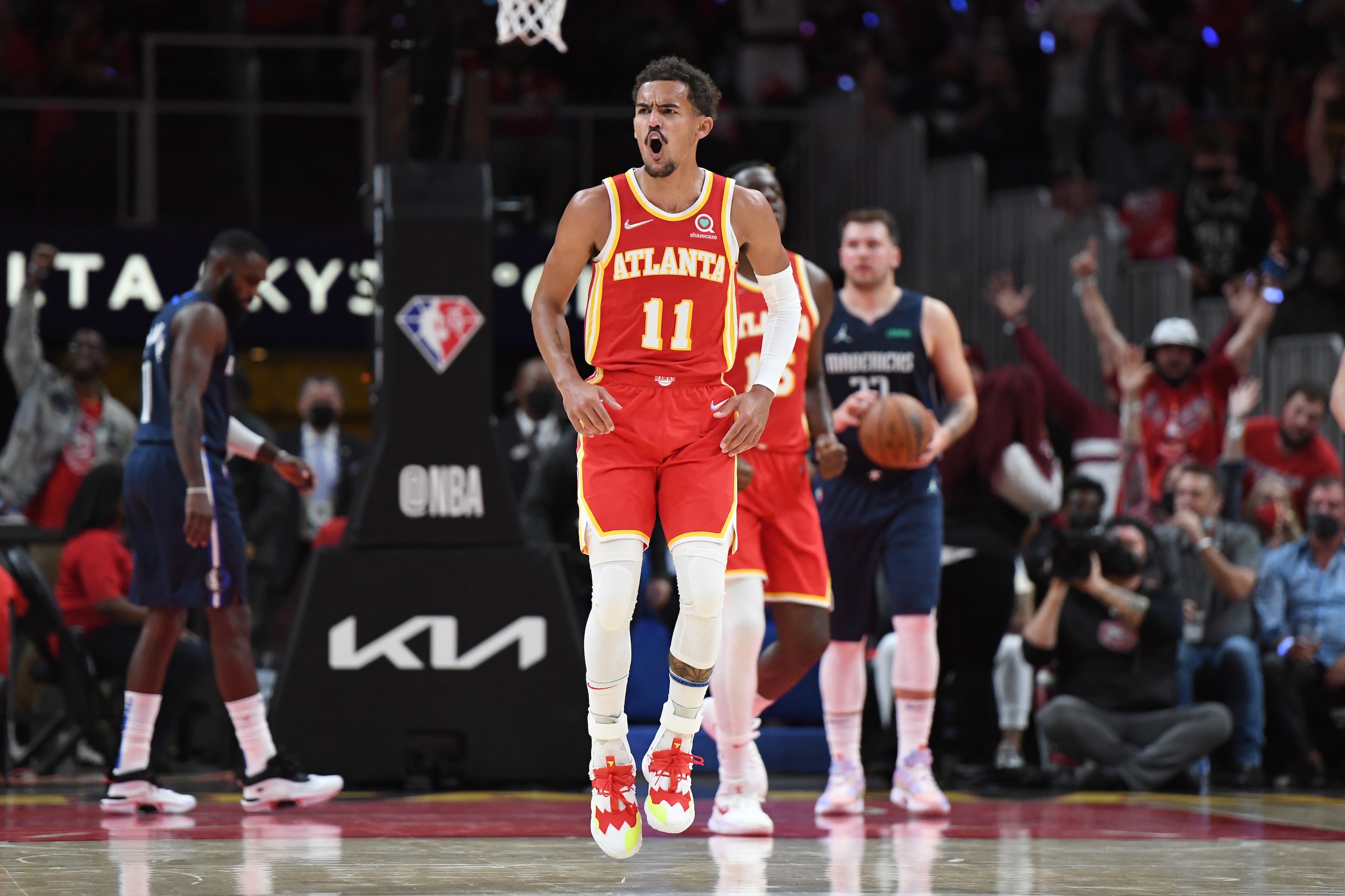 ATLANTA, GA - OCTOBER 21: Trae Young #11 of the Atlanta Hawks celebrates during the gameagainst the Dallas Mavericks on October 21, 2021 at State Farm Arena in Atlanta, Georgia. NOTE TO USER: User expressly acknowledges and agrees that, by downloading and/or using this Photograph, user is consenting to the terms and conditions of the Getty Images License Agreement. Mandatory Copyright Notice: Copyright 2021 NBAE (Photo by Adam Hagy/NBAE via Getty Images) ATLANTA, GA - OCTOBER 21: Trae Young #11 of the Atlanta Hawks celebrates during the gameagainst the Dallas Mavericks on October 21, 2021 at State Farm Arena in Atlanta, Georgia. NOTE TO USER: User expressly acknowledges and agrees that, by downloading and/or using this Photograph, user is consenting to the terms and conditions of the Getty Images License Agreement. Mandatory Copyright Notice: Copyright 2021 NBAE (Photo by Adam Hagy/NBAE via Getty Images)