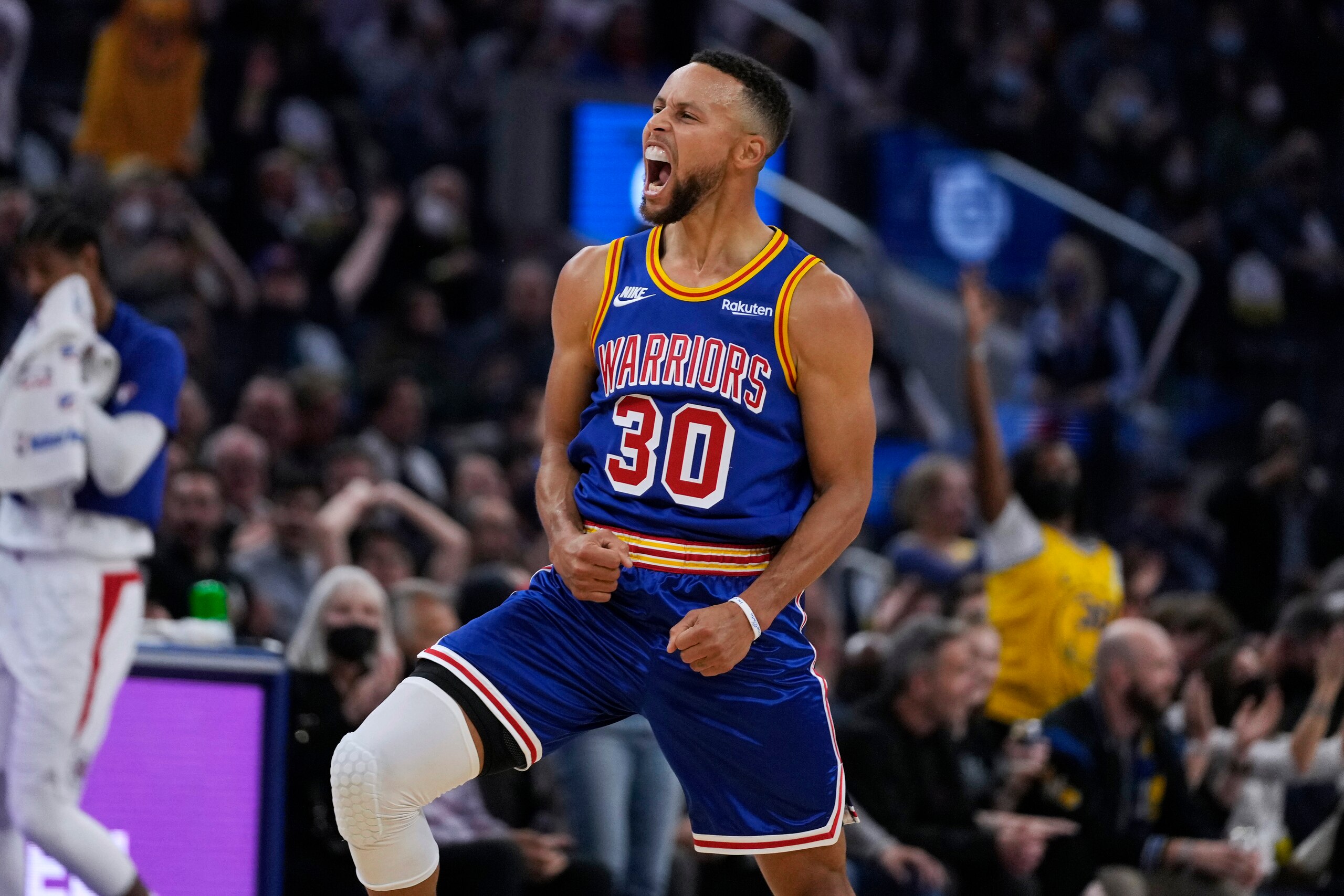 Golden State Warriors guard Stephen Curry (30) reacts after making a 3-point shot against the Los Angeles Clippers during the first half of an NBA basketball game in San Francisco, Thursday, Oct. 21, 2021. (AP Photo/Tony Avelar)