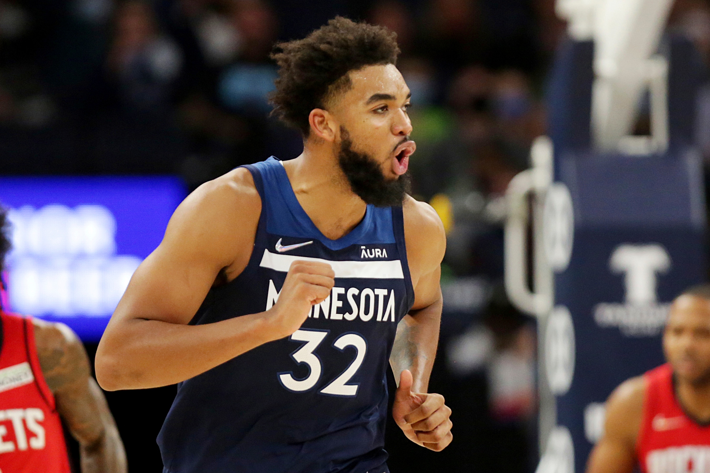 Minnesota Timberwolves center Karl-Anthony Towns celebrates during the second half of the team's NBA basketball game against the Houston Rockets on Wednesday, Oct. 20, 2021, in Minneapolis. (AP Photo/Andy Clayton-King)