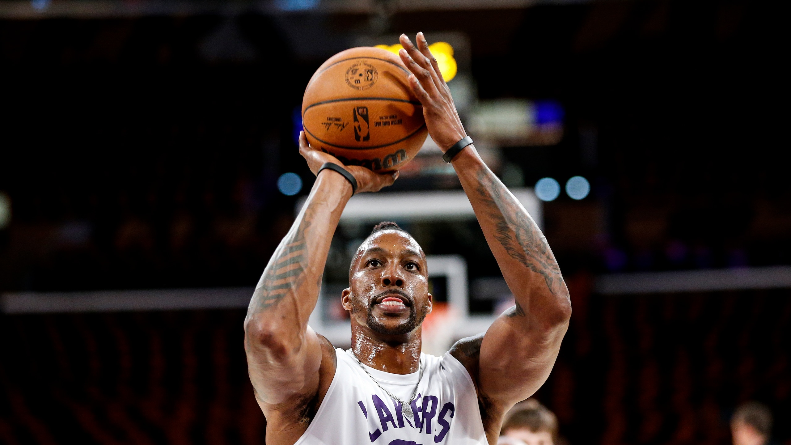 Los Angeles Lakers center Dwight Howard (39) warms up before an NBA basketball game against the Golden State Warriors in Los Angeles, Tuesday, Oct. 19, 2021. (AP Photo/Ringo H.W. Chiu)
