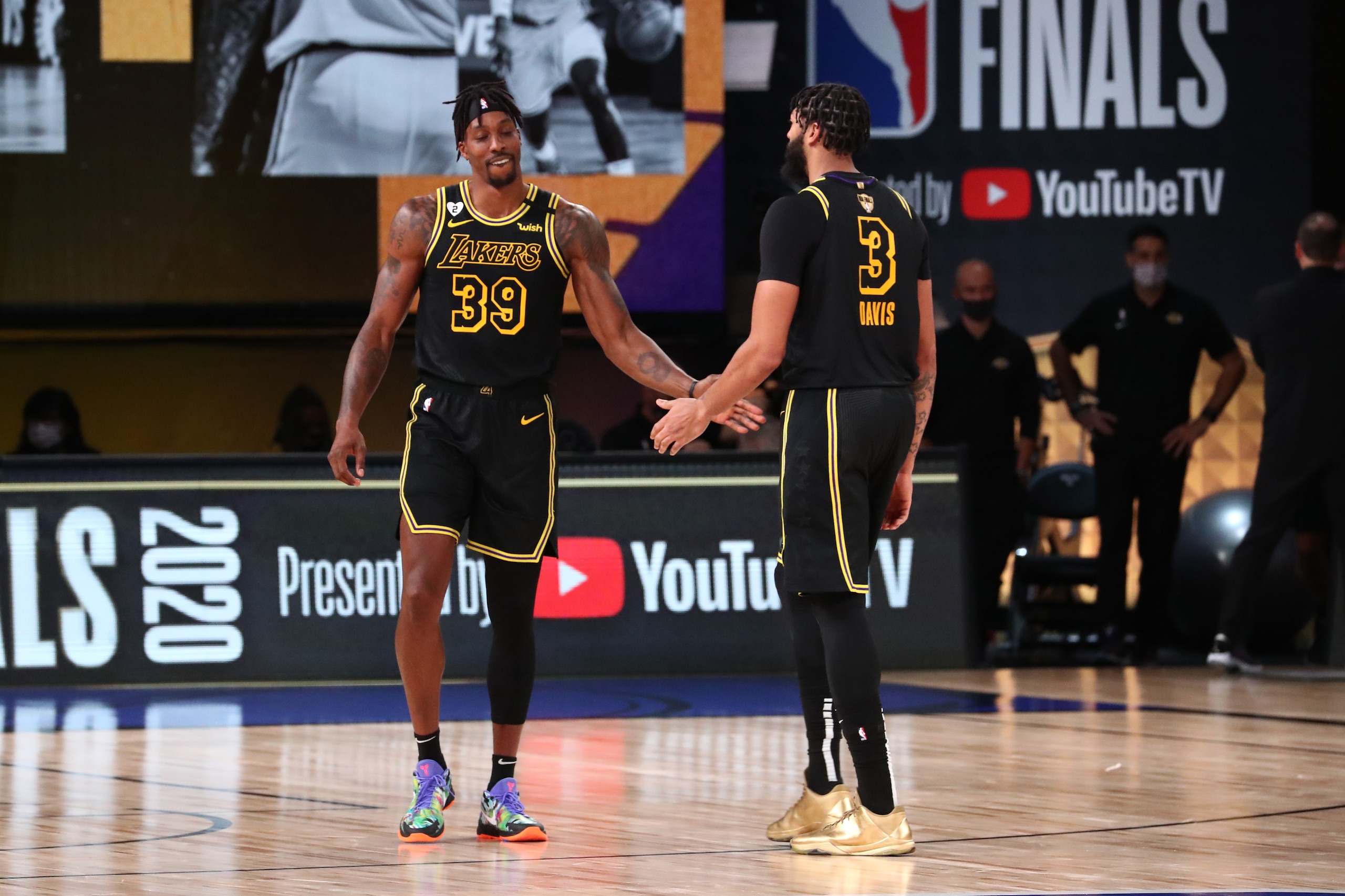 ORLANDO, FL - OCTOBER 9: Dwight Howard #39 high-fives Anthony Davis #3 of the Los Angeles Lakers during Game Five of the NBA Finals on October 9, 2020 at AdventHealth Arena in Orlando, Florida. NOTE TO USER: User expressly acknowledges and agrees that, by downloading and/or using this Photograph, user is consenting to the terms and conditions of the Getty Images License Agreement. Mandatory Copyright Notice: Copyright 2020 NBAE (Photo by Nathaniel S. Butler/NBAE via Getty Images)