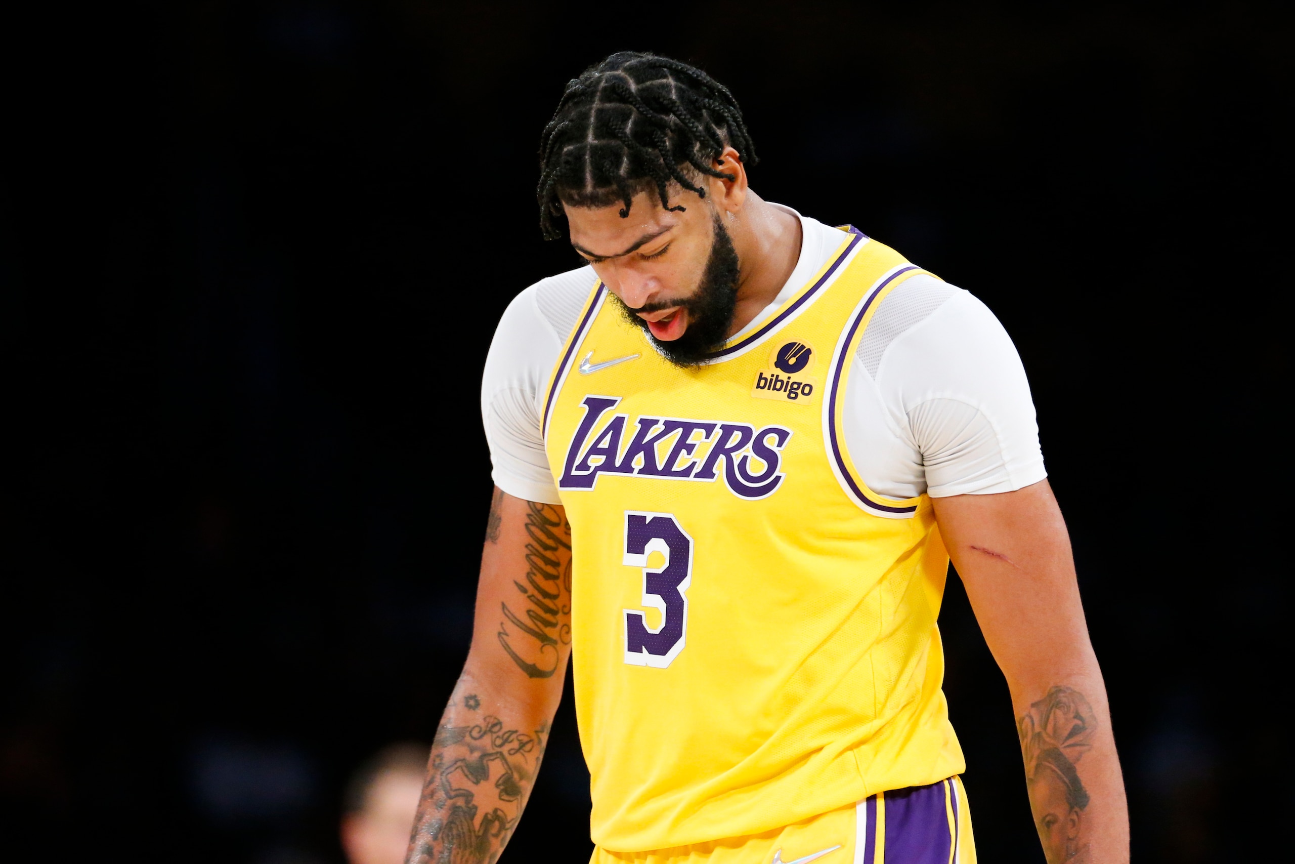 Los Angeles Lakers forward Anthony Davis (3) looks down during the second half of an NBA basketball game against the Golden State Warriors in Los Angeles, Tuesday, Oct. 19, 2021. The Warriors won 121-114. (AP Photo/Ringo H.W. Chiu)
