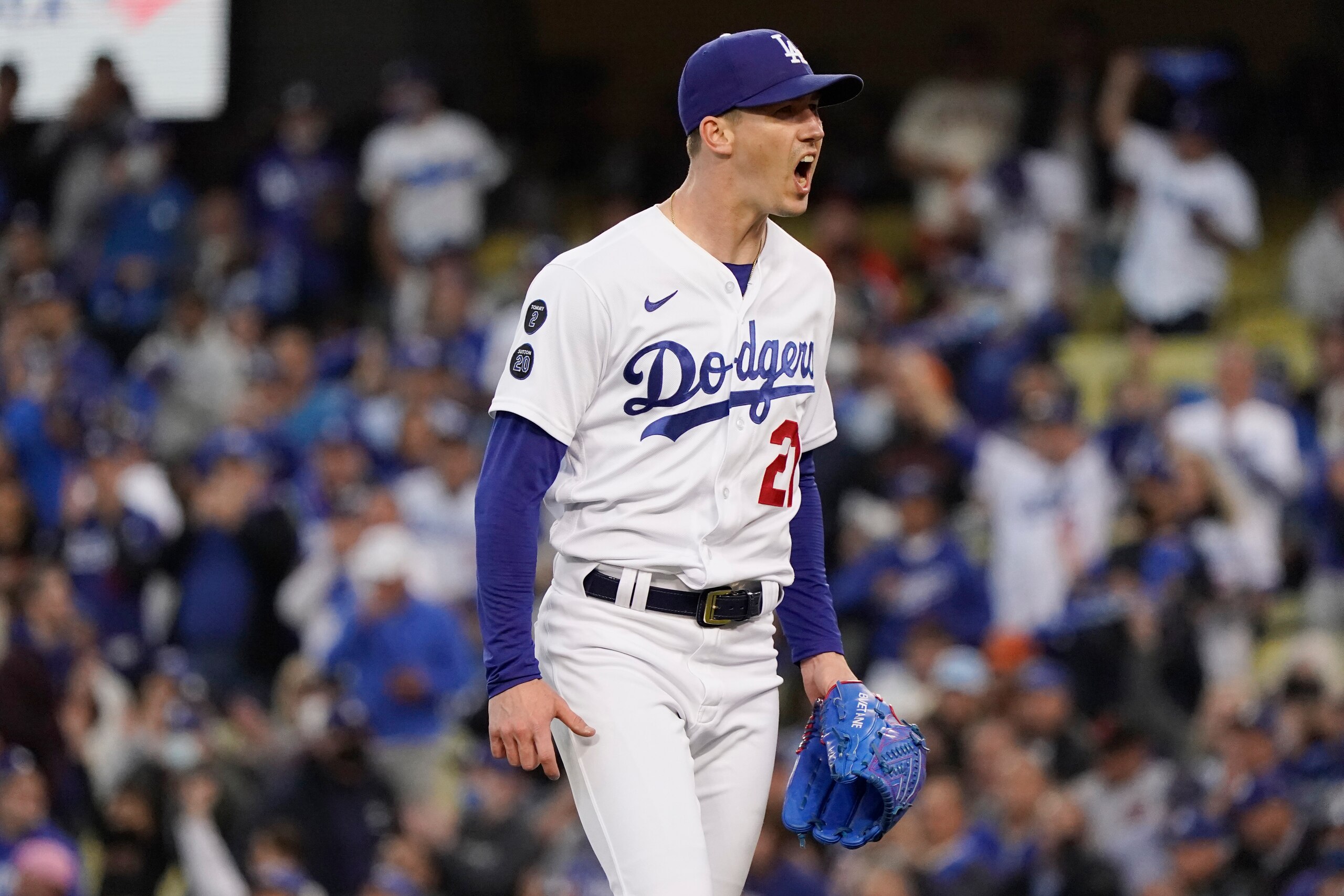 Los Angeles Dodgers starting pitcher Walker Buehler reacts on the mound at the end of the first inning of Game 4 against the San Francisco Giants in a baseball National League Division Series, Tuesday, Oct. 12, 2021, in Los Angeles. (AP Photo/Marcio Jose Sanchez)