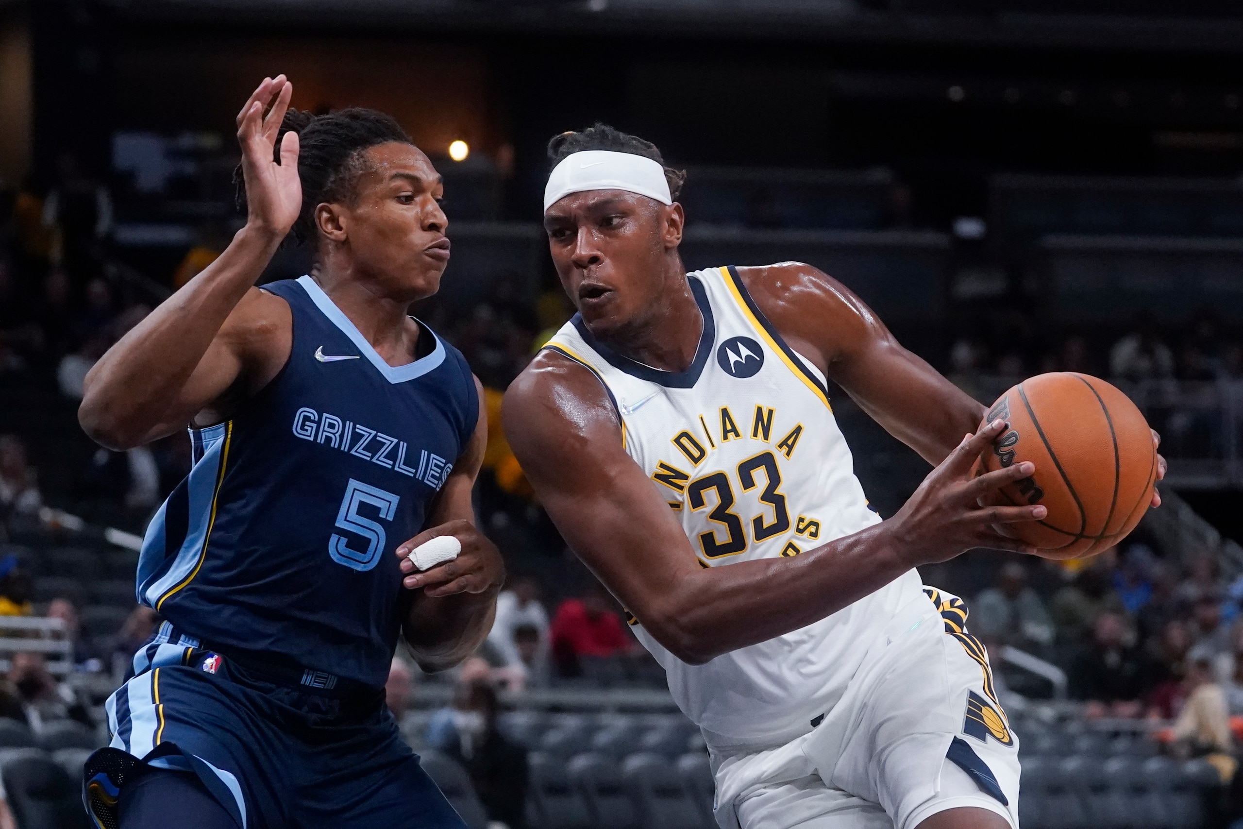 Indiana Pacers' Myles Turner (33) goes to the basket against Memphis Grizzlies' Yves Pons (5) during the first half of an NBA preseason basketball game Wednesday, Oct. 13, 2021, in Indianapolis. (AP Photo/Darron Cummings) Indiana Pacers' Myles Turner (33) goes to the basket against Memphis Grizzlies' Yves Pons (5) during the first half of an NBA preseason basketball game Wednesday, Oct. 13, 2021, in Indianapolis. (AP Photo/Darron Cummings)