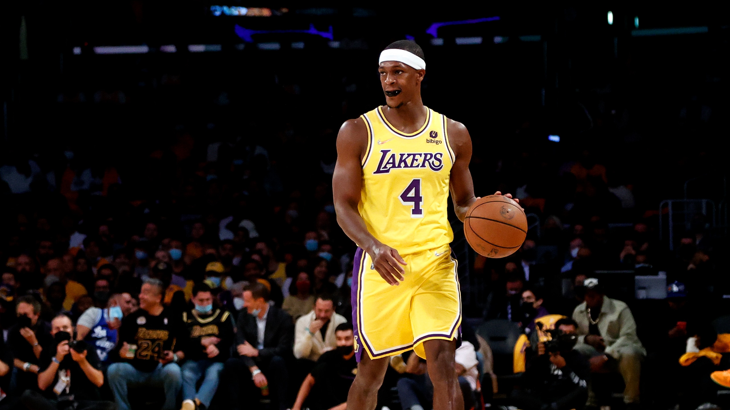Los Angeles Lakers guard Rajon Rondo (4) dribbles against the Golden State Warriors during the first half of an NBA basketball game in Los Angeles, Tuesday, Oct. 19, 2021. (AP Photo/Ringo H.W. Chiu)