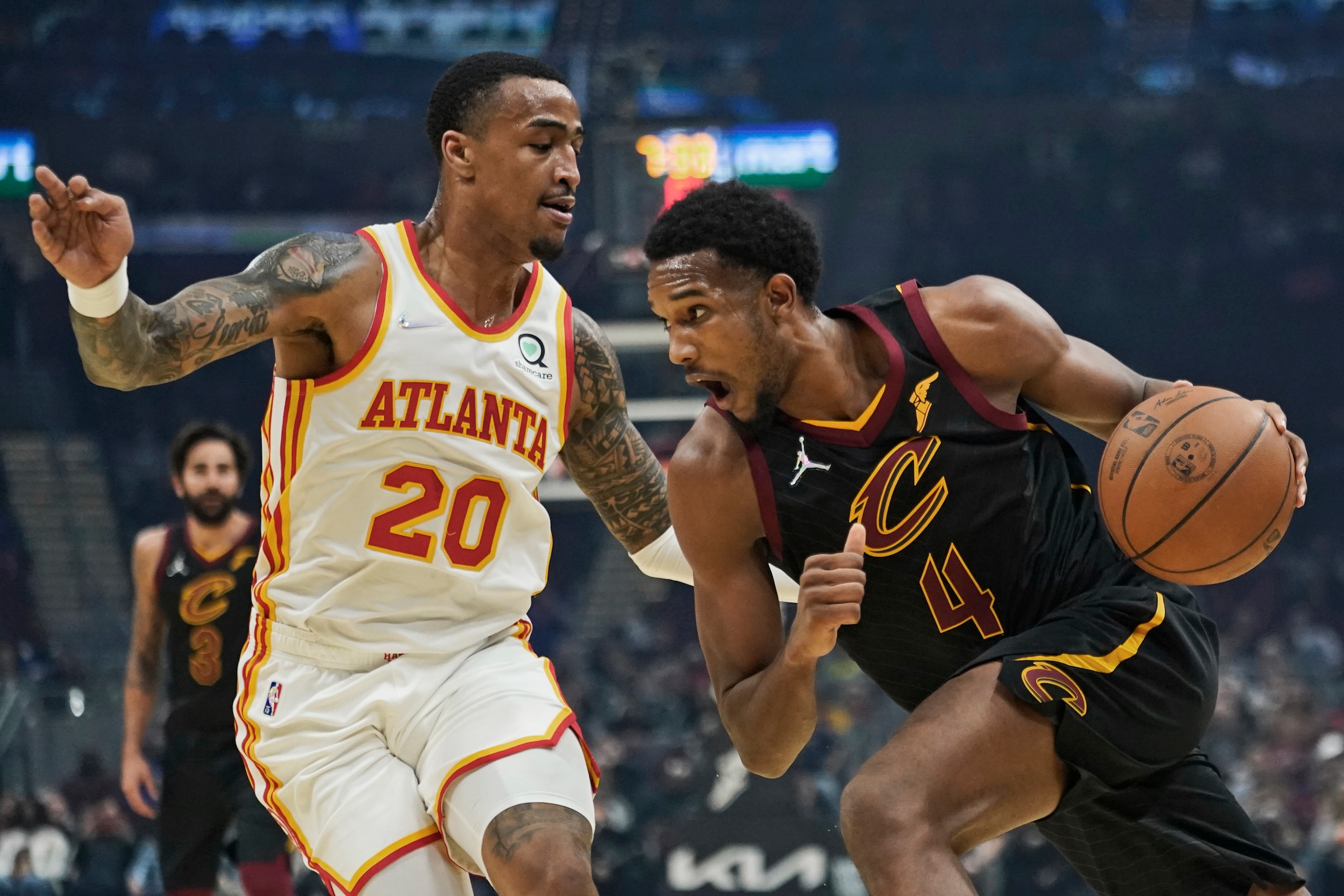 Cleveland Cavaliers' Evan Mobley (4) drives against Atlanta Hawks' John Collins (20) in the first half of an NBA basketball game, Saturday, Oct. 23, 2021, in Cleveland. (AP Photo/Tony Dejak) Cleveland Cavaliers' Evan Mobley (4) drives against Atlanta Hawks' John Collins (20) in the first half of an NBA basketball game, Saturday, Oct. 23, 2021, in Cleveland. (AP Photo/Tony Dejak)