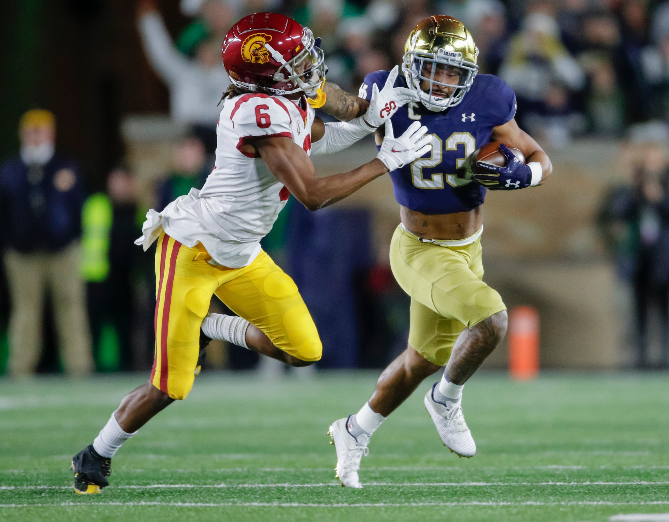 SOUTH BEND, IN - OCTOBER 23: Isaac Taylor-Stuart #6 of the USC Trojans tries to make the stop on Kyren Williams #23 of the Notre Dame Fighting Irish during the first half at Notre Dame Stadium on October 23, 2021 in South Bend, Indiana. (Photo by Michael Hickey/Getty Images)