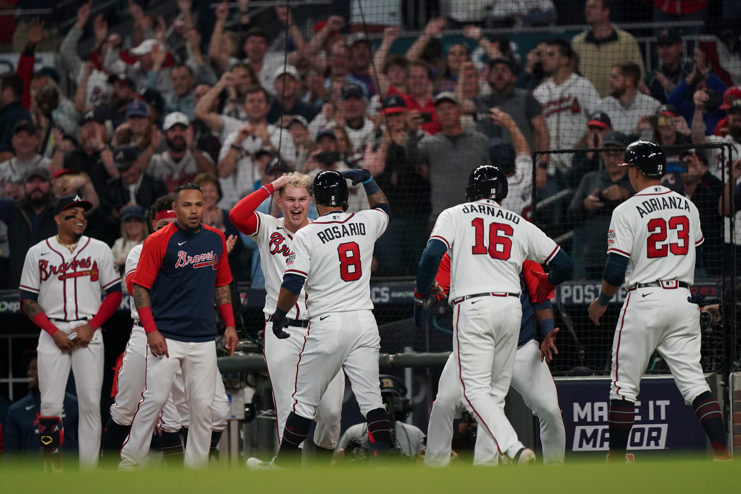 Atlanta Braves' Eddie Rosario (8) celebrates after hitting a three run home run during the fourth inning in Game 6 of baseball's National League Championship Series against the Los Angeles Dodgers Saturday, Oct. 23, 2021, in Atlanta. (AP Photo/Brynn Anderson) Atlanta Braves' Eddie Rosario (8) celebrates after hitting a three run home run during the fourth inning in Game 6 of baseball's National League Championship Series against the Los Angeles Dodgers Saturday, Oct. 23, 2021, in Atlanta. (AP Photo/Brynn Anderson)