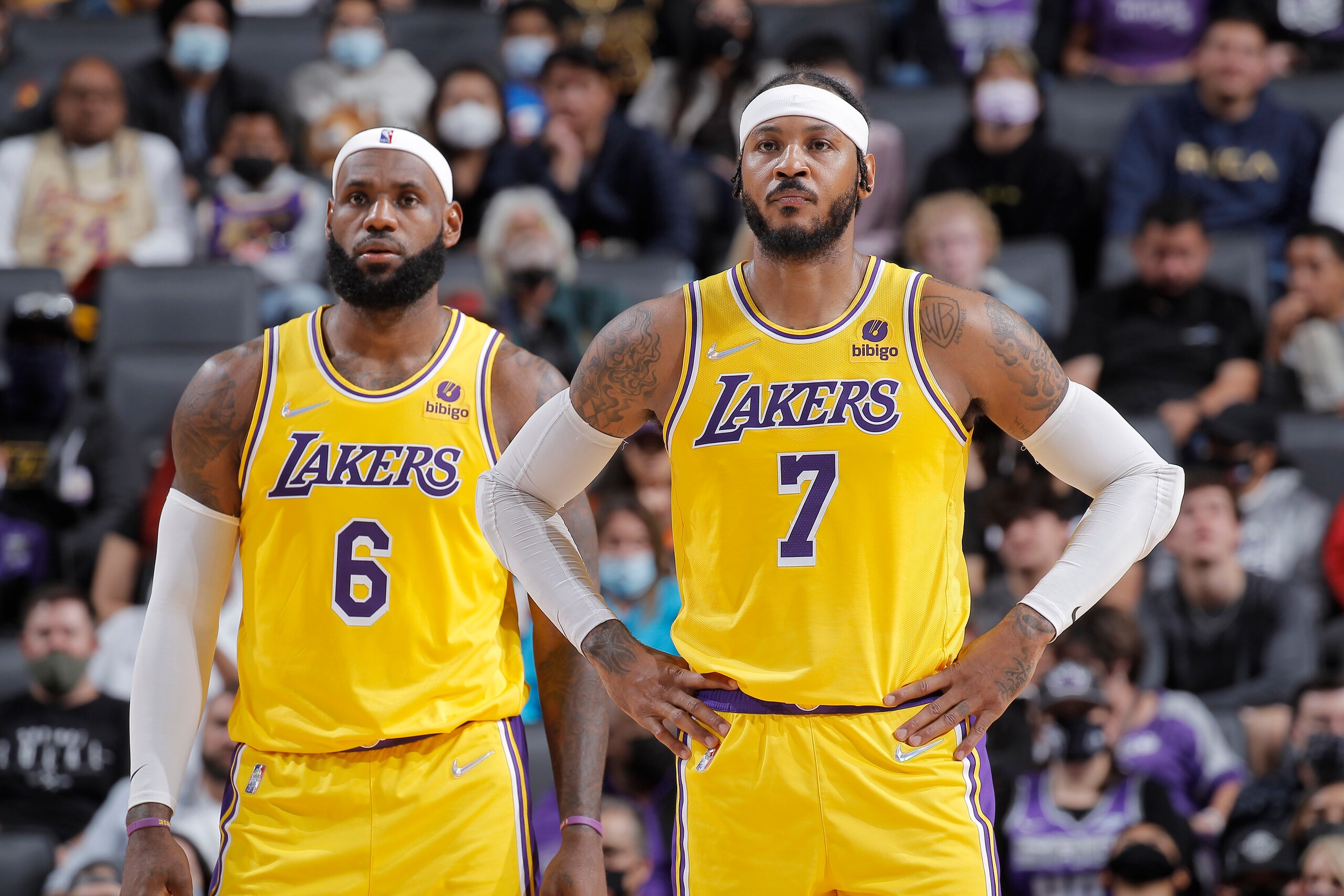 SACRAMENTO, CA - OCTOBER 14: LeBron James #23 and Carmelo Anthony #7 of the Los Angeles Lakers look on during the game against the Sacramento Kings on October 14, 2021 at Golden 1 Center in Sacramento, California. NOTE TO USER: User expressly acknowledges and agrees that, by downloading and or using this photograph, User is consenting to the terms and conditions of the Getty Images Agreement. Mandatory Copyright Notice: Copyright 2021 NBAE (Photo by Rocky Widner/NBAE via Getty Images)