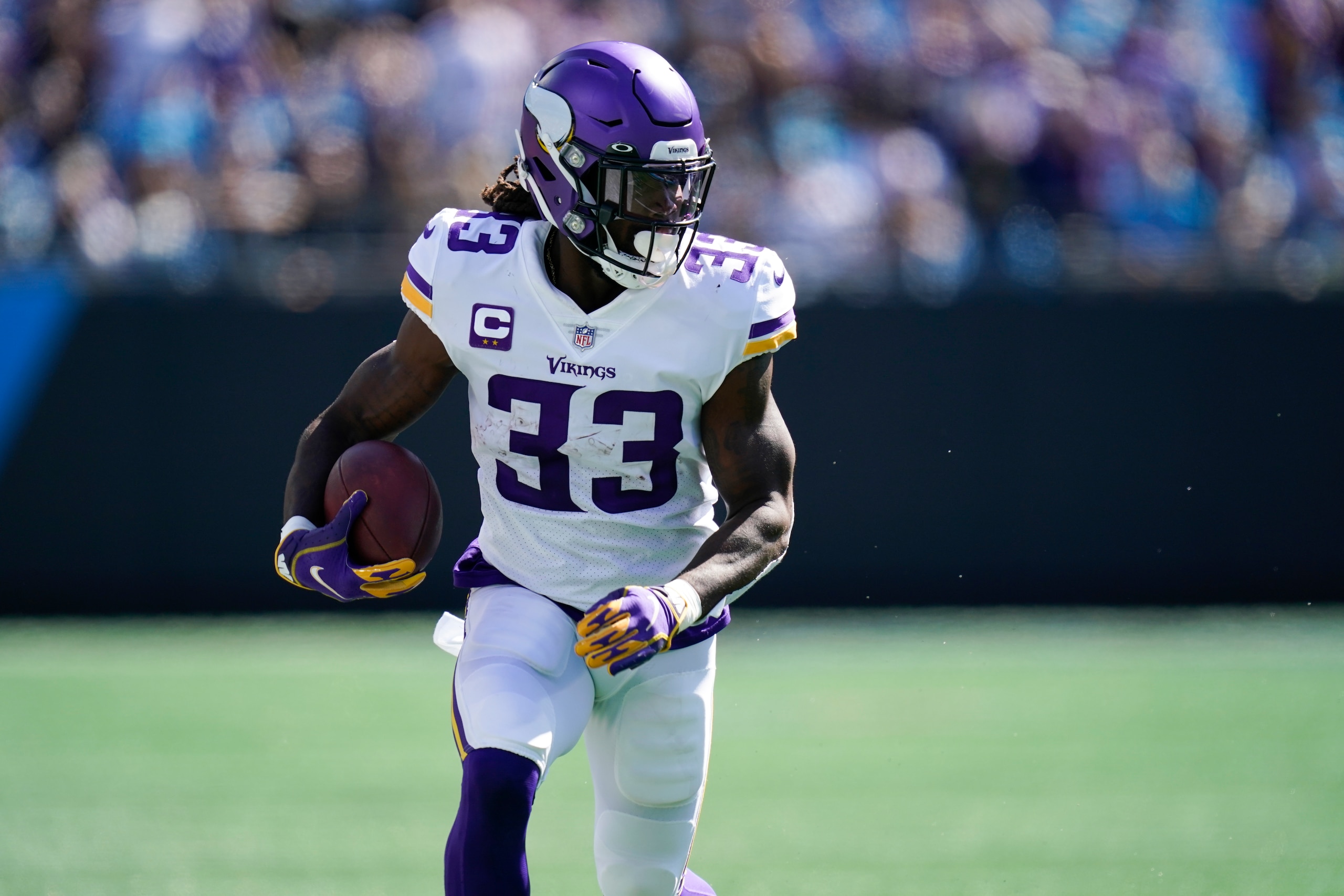 Minnesota Vikings running back Dalvin Cook (33) runs against the Carolina Panthers during the first half of an NFL football game, Sunday, Oct. 17, 2021, in Charlotte, N.C. (AP Photo/Gerald Herbert)