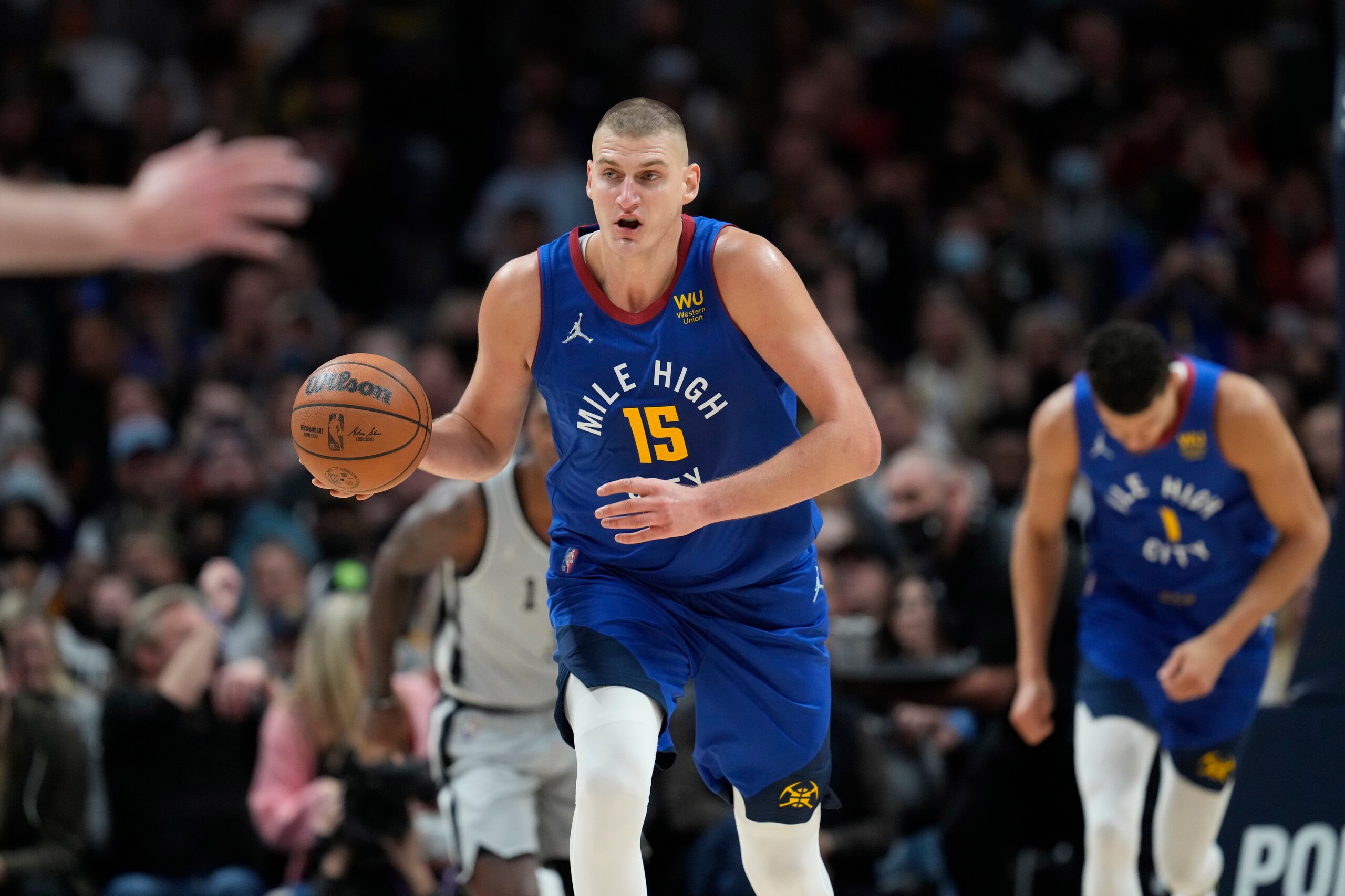 Denver Nuggets center Nikola Jokic (15) in the second half of an NBA basketball game Friday, Oct. 22, 2021, in Denver. The Nuggets won 102-96. (AP Photo/David Zalubowski)