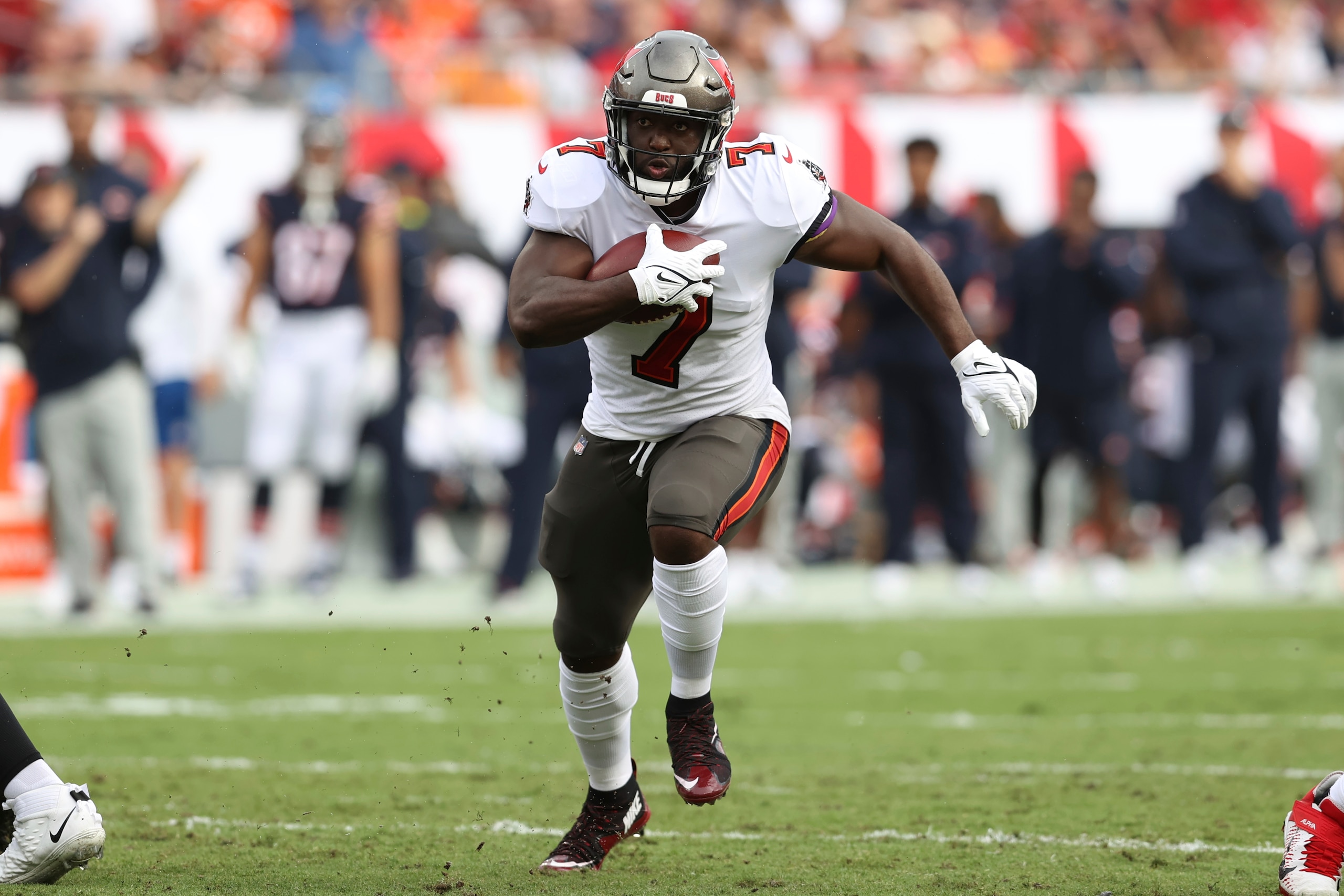 Tampa Bay Buccaneers running back Leonard Fournette (7) runs against the Chicago Bears during the first half of an NFL football game Sunday, Oct. 24, 2021, in Tampa, Fla. (AP Photo/Mark LoMoglio)