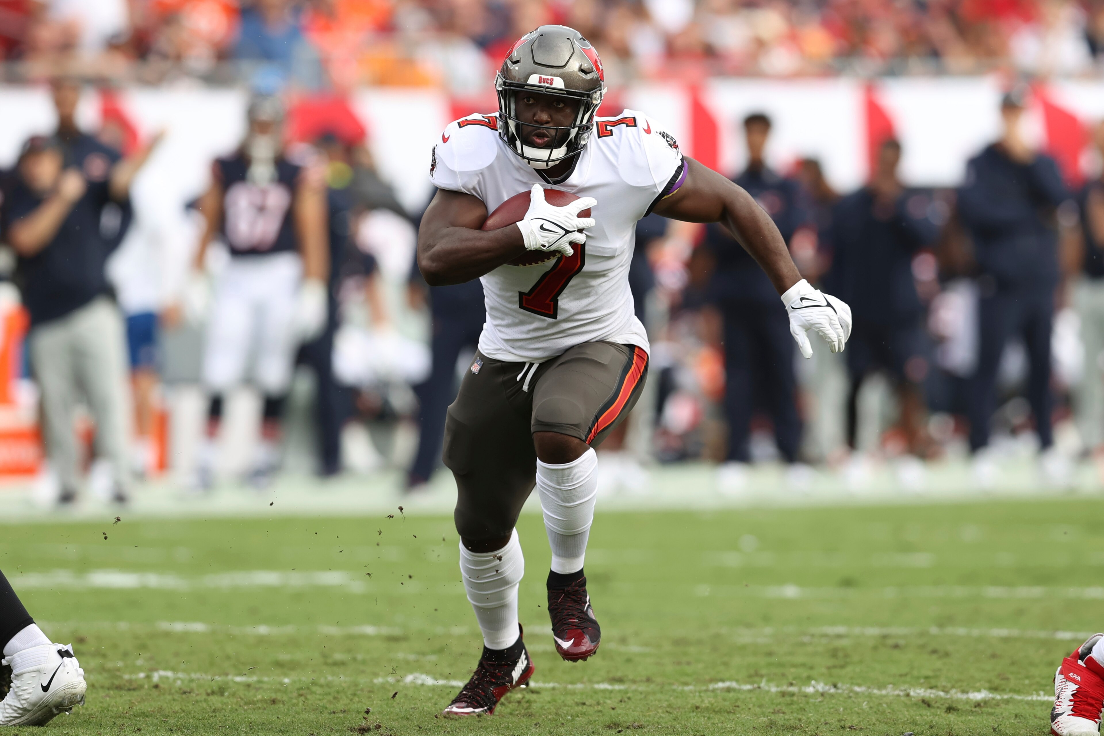 Tampa Bay Buccaneers running back Leonard Fournette (7) runs against the Chicago Bears during the first half of an NFL football game Sunday, Oct. 24, 2021, in Tampa, Fla. (AP Photo/Mark LoMoglio)