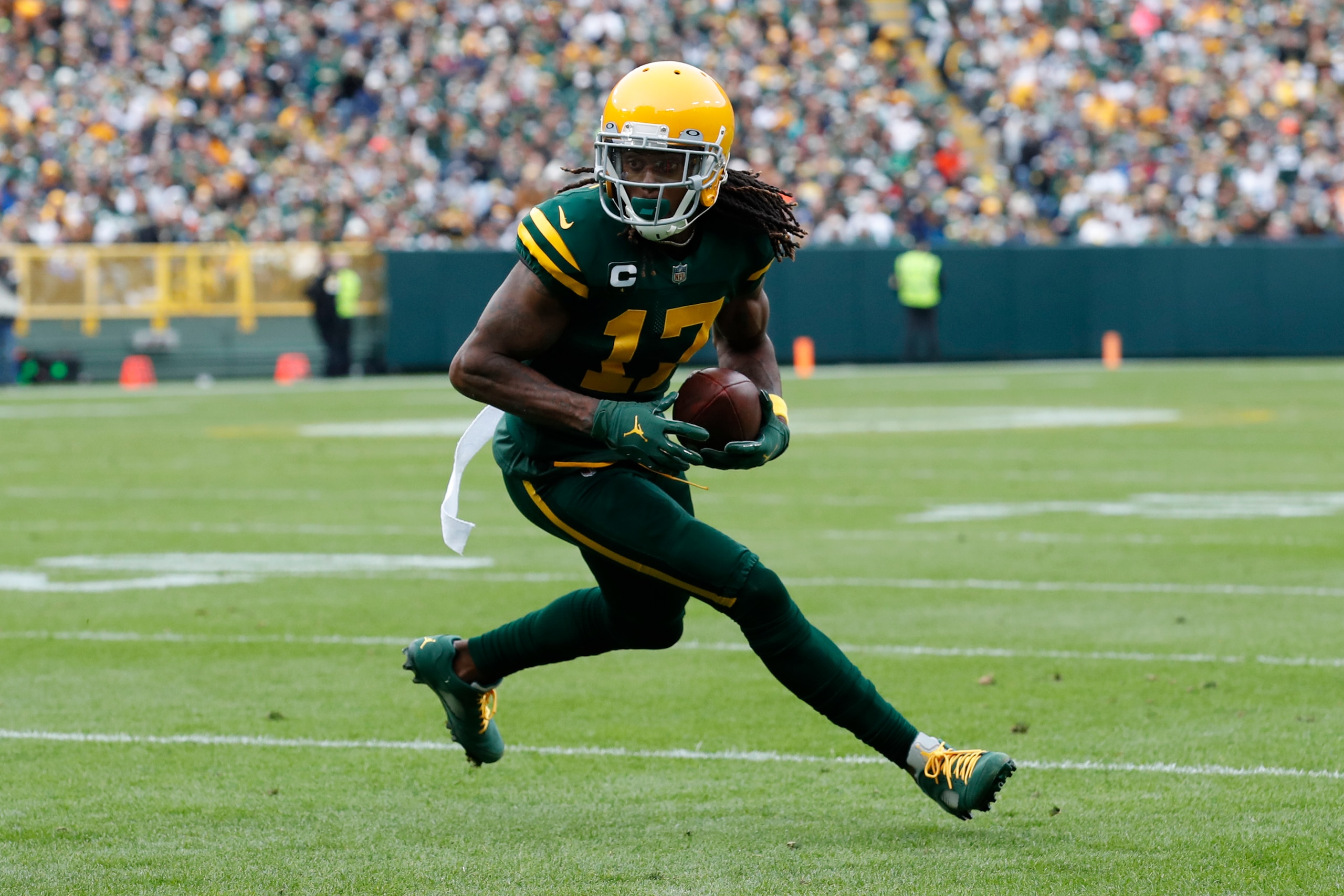 Green Bay Packers wide receiver Davante Adams (17) runs the ball after a catch against the Washington Football Team during an NFL football game Sunday, Oct. 24, 2021, in Green Bay, Wis. (Jeff Haynes/AP Images for Panini)