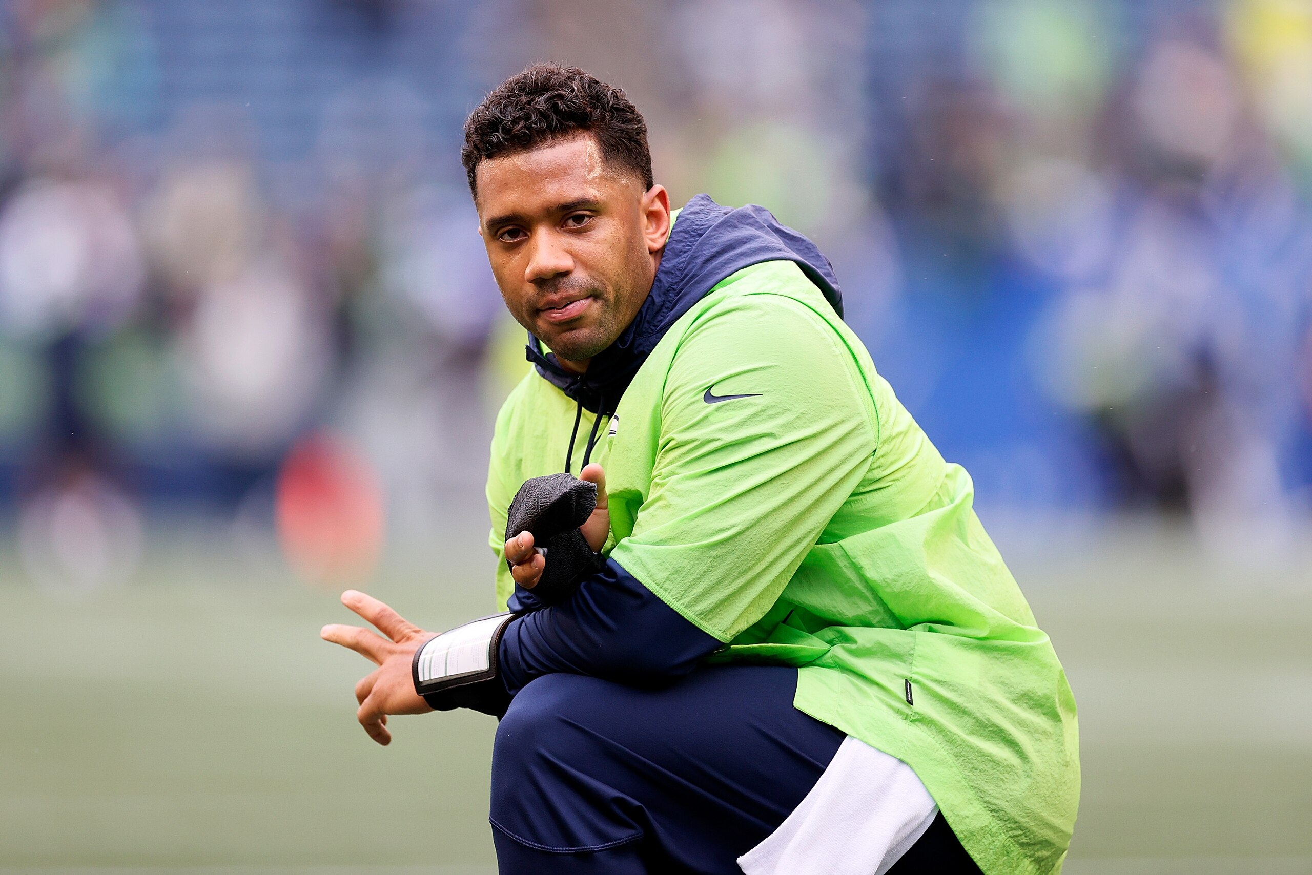 SEATTLE, WASHINGTON - OCTOBER 25:  Russell Wilson #3 of the Seattle Seahawks participates in warmups prior to a game against the New Orleans Saints at Lumen Field on October 25, 2021 in Seattle, Washington. (Photo by Steph Chambers/Getty Images)