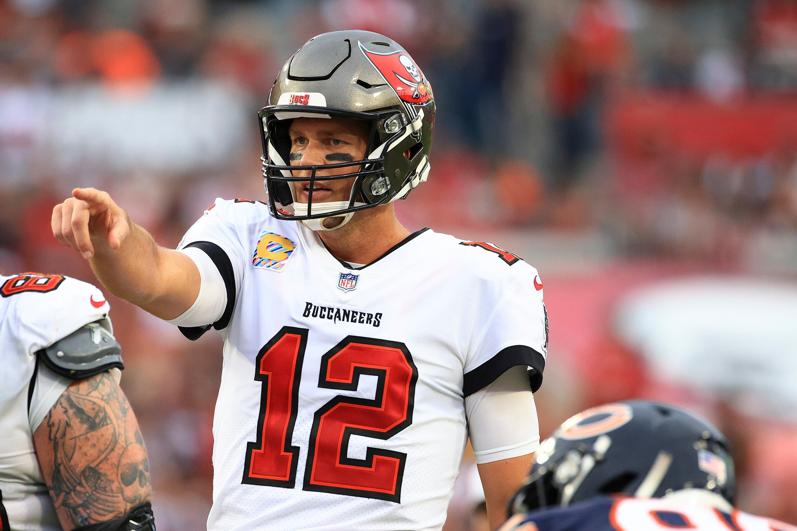TAMPA, FLORIDA - OCTOBER 24: Tom Brady #12 of the Tampa Bay Buccaneers calls out instructions in the second quarter against the Chicago Bears in the game at Raymond James Stadium on October 24, 2021 in Tampa, Florida. (Photo by Mike Ehrmann/Getty Images) TAMPA, FLORIDA - OCTOBER 24: Tom Brady #12 of the Tampa Bay Buccaneers calls out instructions in the second quarter against the Chicago Bears in the game at Raymond James Stadium on October 24, 2021 in Tampa, Florida. (Photo by Mike Ehrmann/Getty Images)