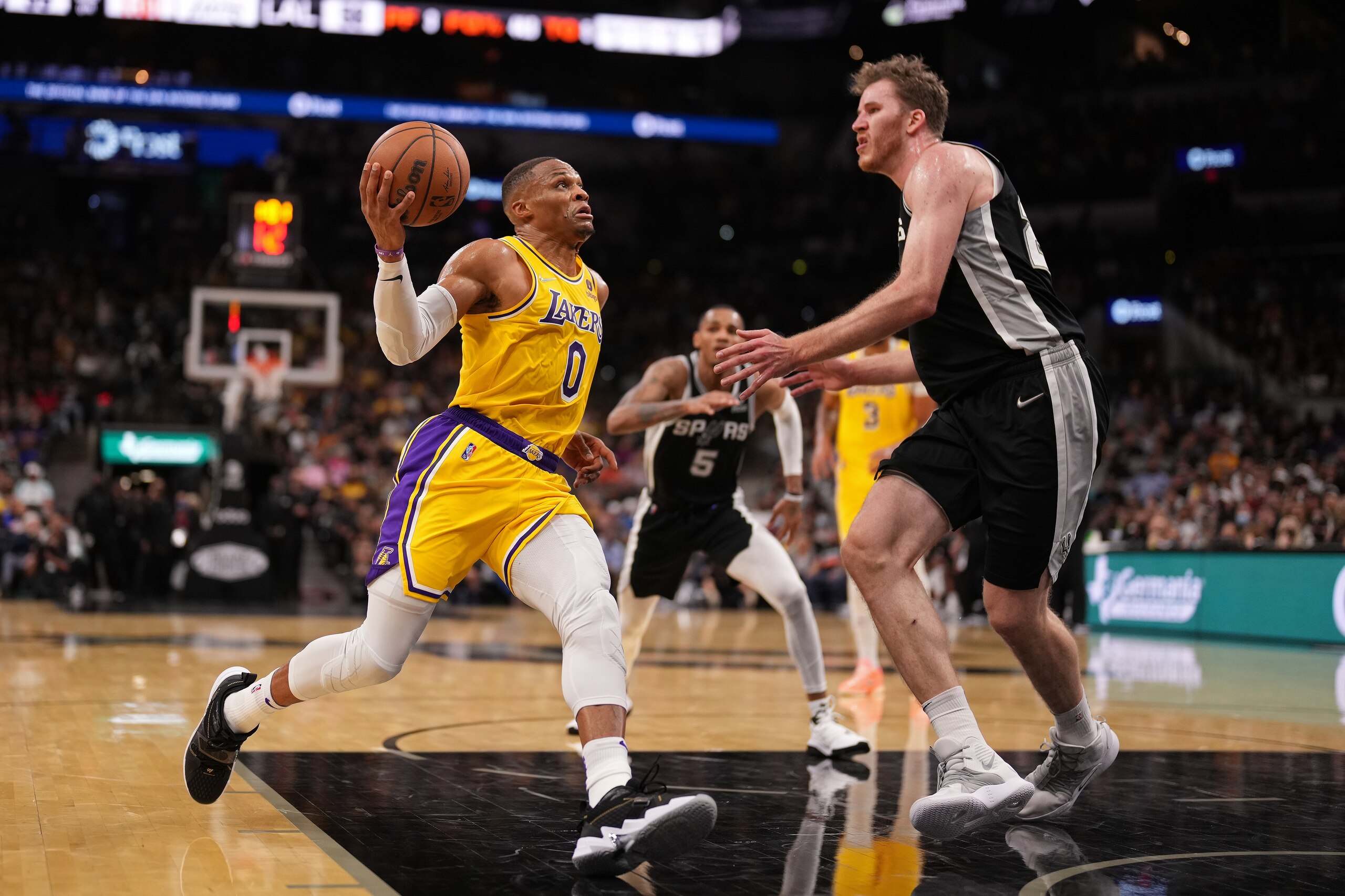 SAN ANTONIO, TX - OCTOBER 26: Russell Westbrook #0 of the Los Angeles Lakers drives to the basket against the San Antonio Spurs on October 26, 2021 at the AT&T Center in San Antonio, Texas. NOTE TO USER: User expressly acknowledges and agrees that, by downloading and or using this photograph, user is consenting to the terms and conditions of the Getty Images License Agreement. Mandatory Copyright Notice: Copyright 2021 NBAE (Photos by Darren Carroll/NBAE via Getty Images)