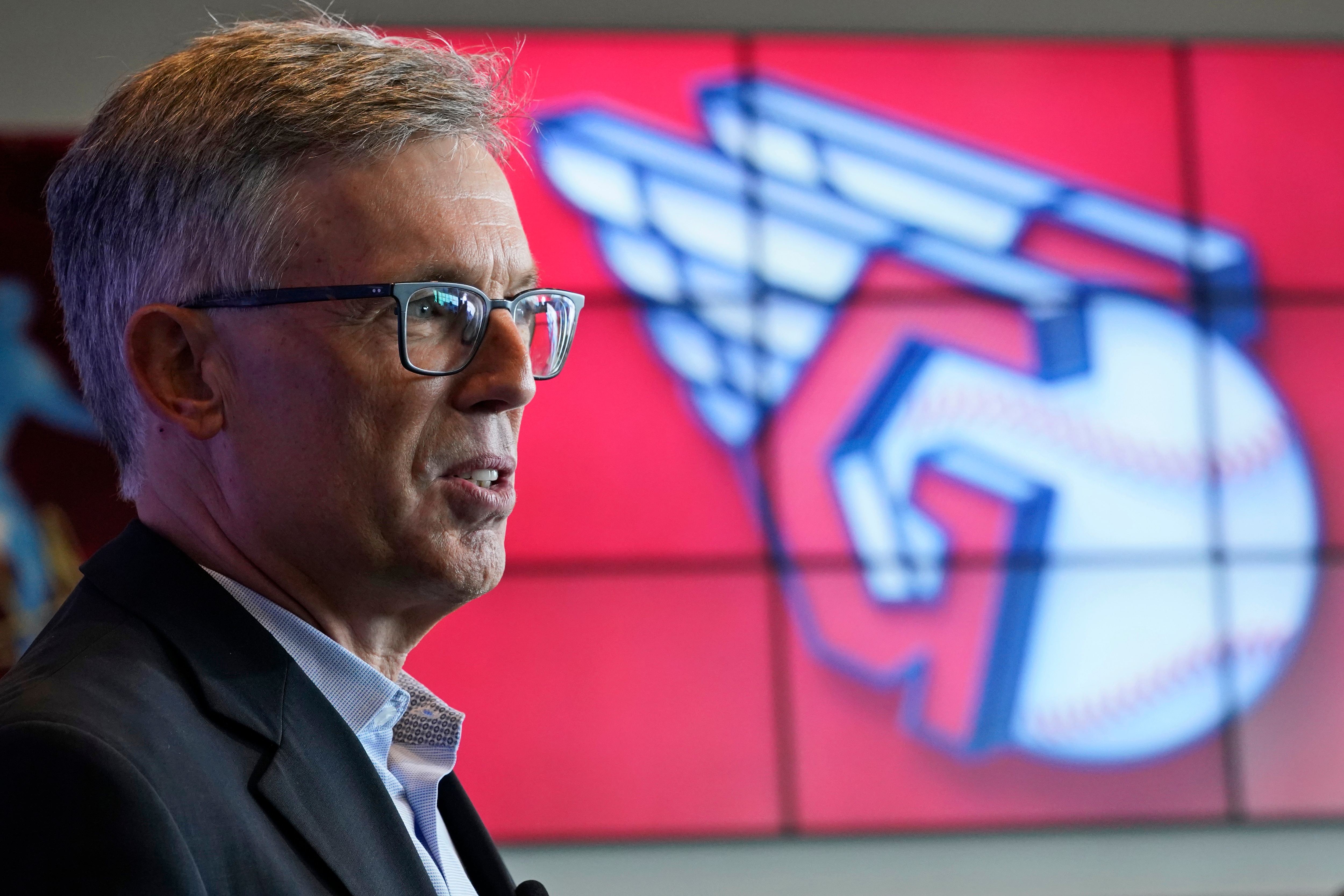 Cleveland Indians owner Paul Dolan speaks to the media as the new Indians logo is displayed, Friday, July 23, 2021, in Cleveland. Known as the Indians since 1915, Cleveland's Major League Baseball team will be called Guardians. The ballclub announced the name change Friday, effective at the end of the 2021 season. (AP Photo/Tony Dejak)