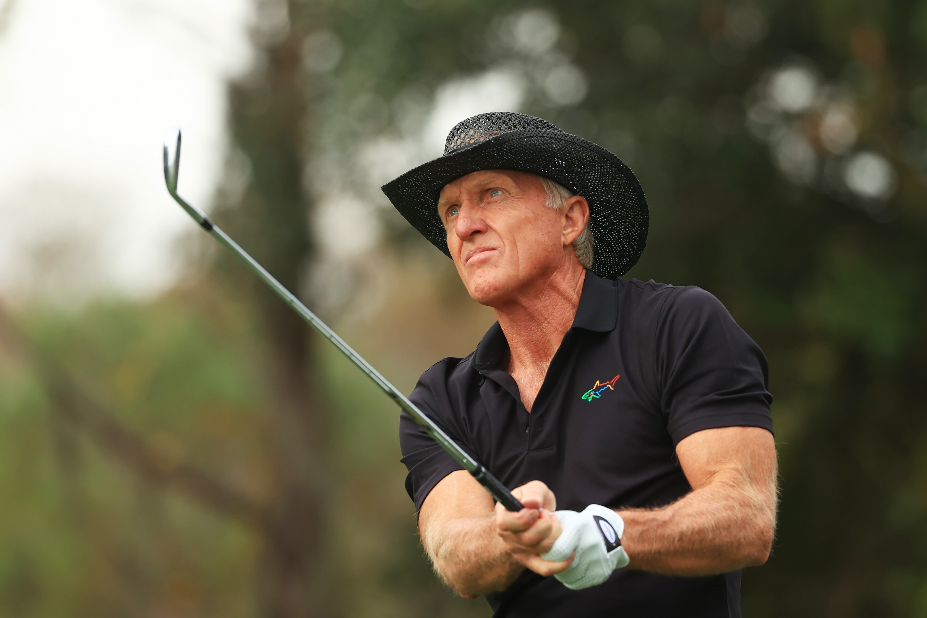 ORLANDO, FLORIDA - DECEMBER 20: Greg Norman of Australia plays his shot from the fourth tee during the final round of the PNC Championship at the Ritz-Carlton Golf Club Orlando on December 20, 2020 in Orlando, Florida. (Photo by Mike Ehrmann/Getty Images)