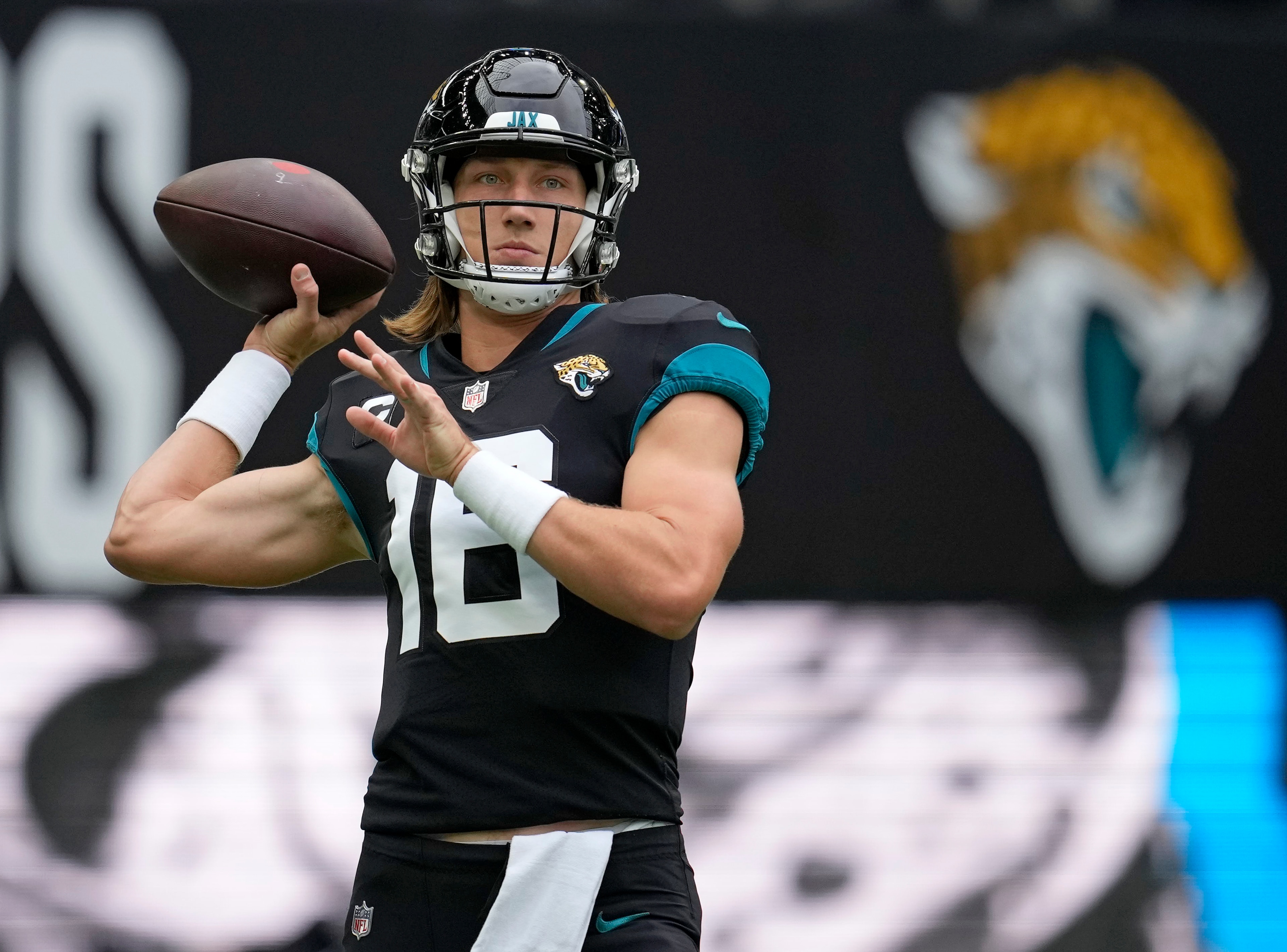 Jacksonville Jaguars quarterback Trevor Lawrence (16) prepares to pass the ball as he warms-up before an NFL football game between the Miami Dolphins and the Jacksonville Jaguars at the Tottenham Hotspur stadium in London, England, Sunday, Oct. 17, 2021. (AP Photo/Matt Dunham) Jacksonville Jaguars quarterback Trevor Lawrence (16) prepares to pass the ball as he warms-up before an NFL football game between the Miami Dolphins and the Jacksonville Jaguars at the Tottenham Hotspur stadium in London, England, Sunday, Oct. 17, 2021. (AP Photo/Matt Dunham)