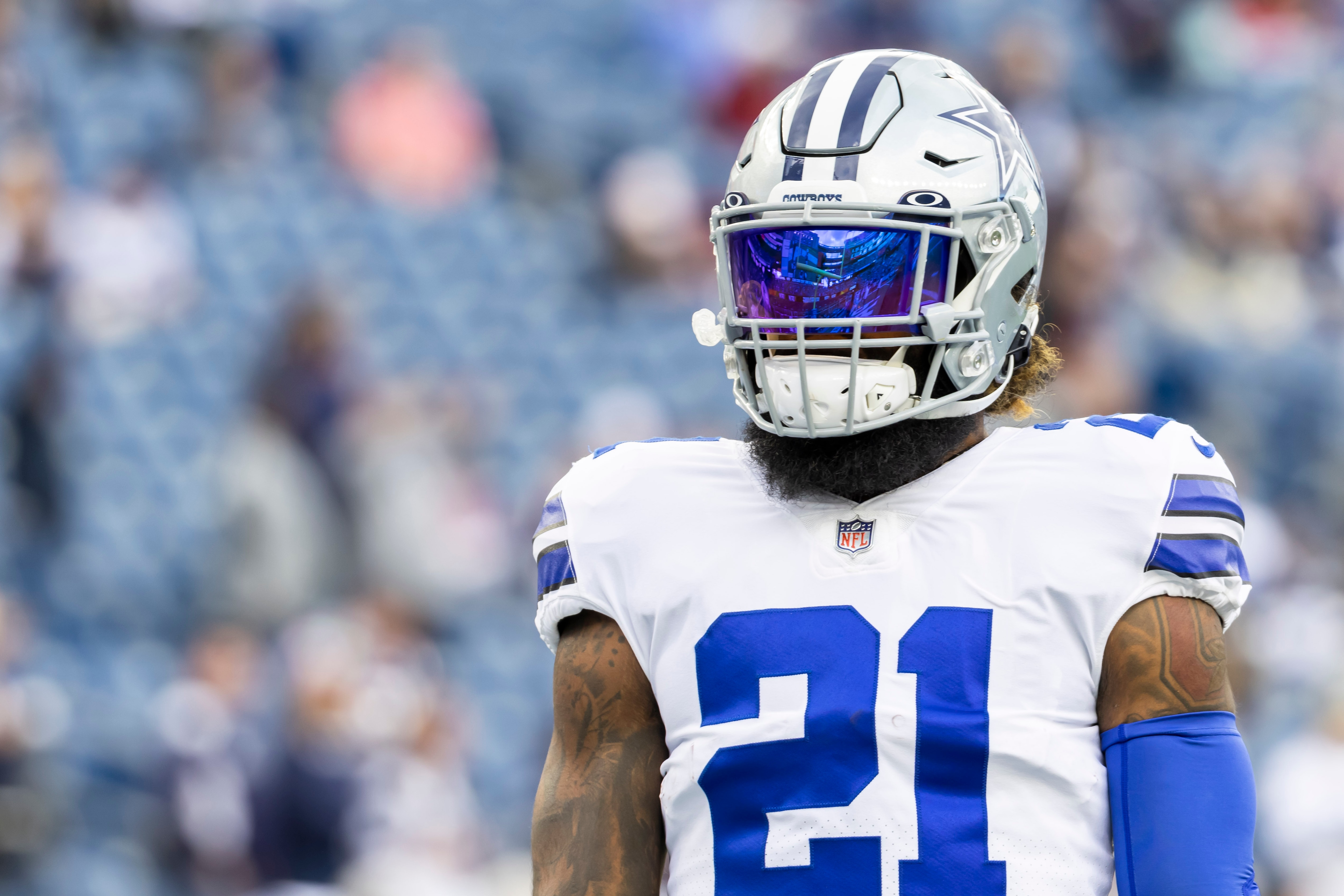 Dallas Cowboys running back Ezekiel Elliott (21) focuses prior to an NFL football game against the New England Patriots, Sunday, Oct. 17, 2021, in Foxborough, Mass. (AP Photo/Greg M. Cooper)