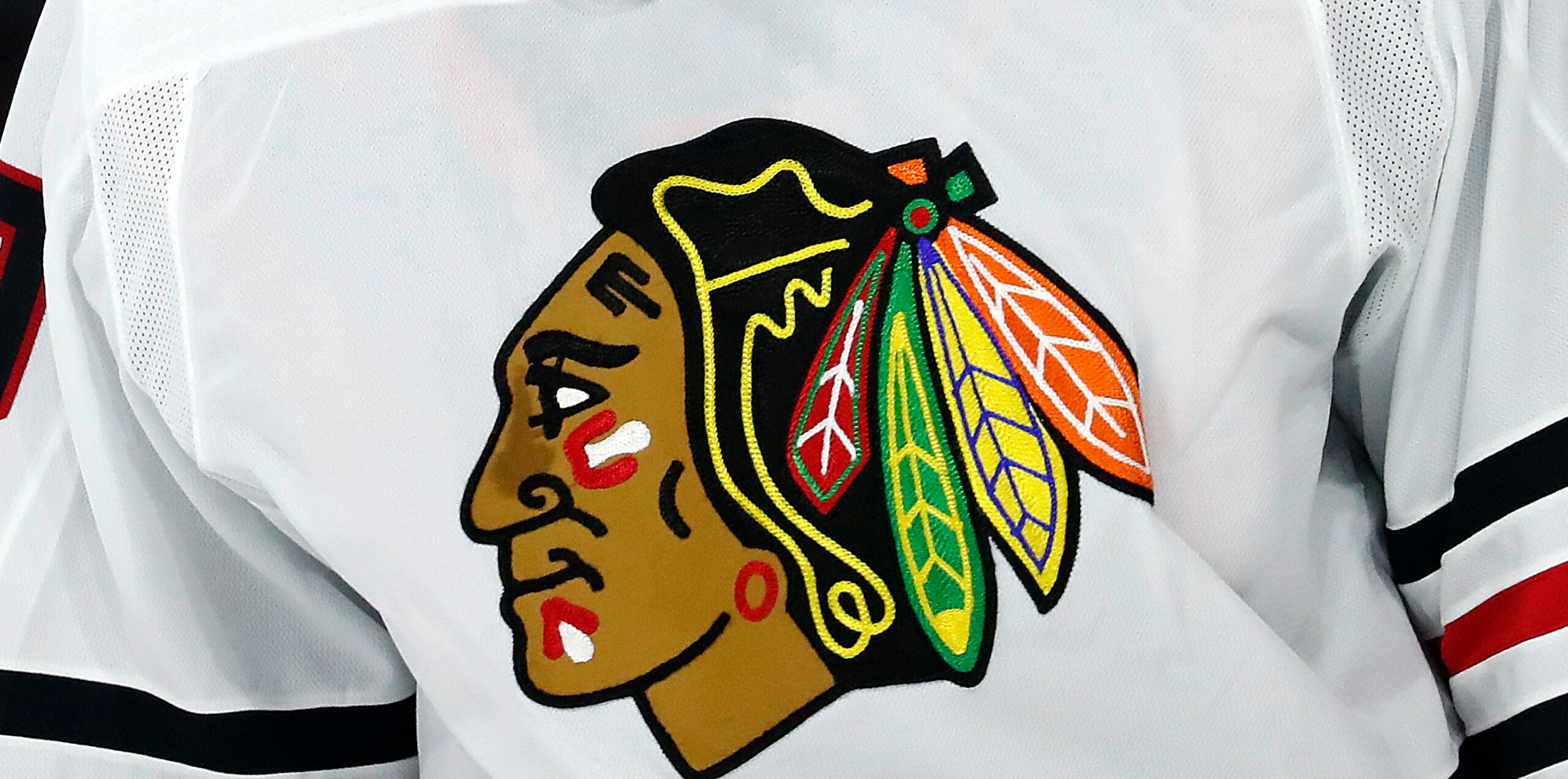FILE - In this May 3, 2021, file photo, the Chicago Blackhawks logo is displayed on a jersey in Raleigh, N.C. An attorney who represents a former Blackhawks player who alleges he was sexually assaulted by a then-assistant coach in 2010 says her client has been interviewed as part of the team’s review of the accusations. (AP Photo/Karl B DeBlaker, File) FILE - In this May 3, 2021, file photo, the Chicago Blackhawks logo is displayed on a jersey in Raleigh, N.C. An attorney who represents a former Blackhawks player who alleges he was sexually assaulted by a then-assistant coach in 2010 says her client has been interviewed as part of the team’s review of the accusations. (AP Photo/Karl B DeBlaker, File)