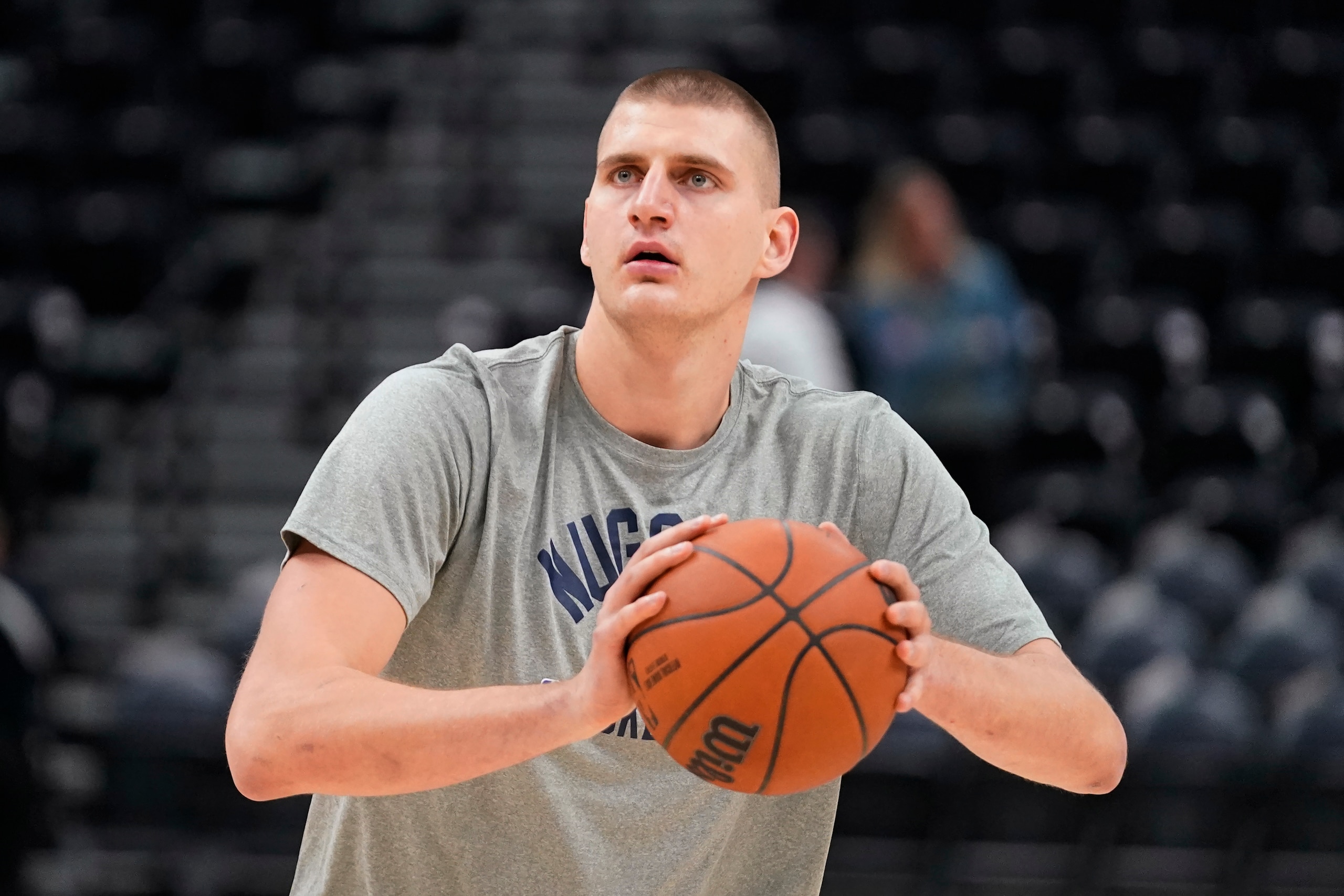 Denver Nuggets center Nikola Jokic warms up before the start of their NBA basketball game against the Utah Jazz Tuesday, Oct. 26, 2021, in Salt Lake City. (AP Photo/Rick Bowmer)