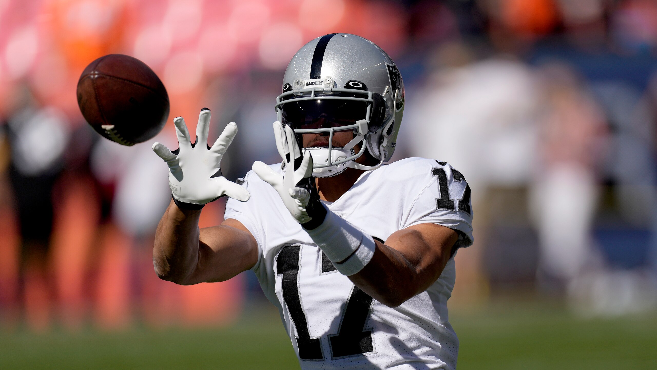 Las Vegas Raiders wide receiver Willie Snead (17) warms up prior to an NFL football game against the Denver Broncos, Sunday, Oct. 17, 2021, in Denver. (AP Photo/David Zalubowski)