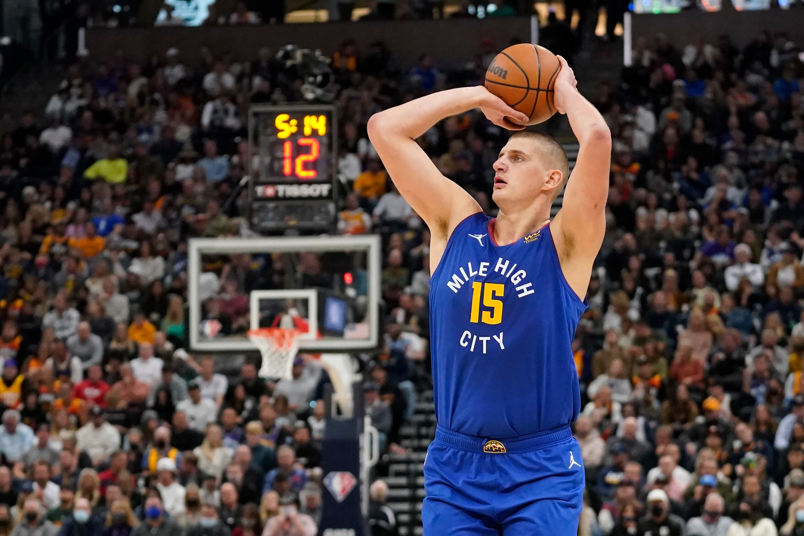 Denver Nuggets center Nikola Jokic (15) shoots against the Utah Jazz in the first half during an NBA basketball game Tuesday, Oct. 26, 2021, in Salt Lake City. (AP Photo/Rick Bowmer)
