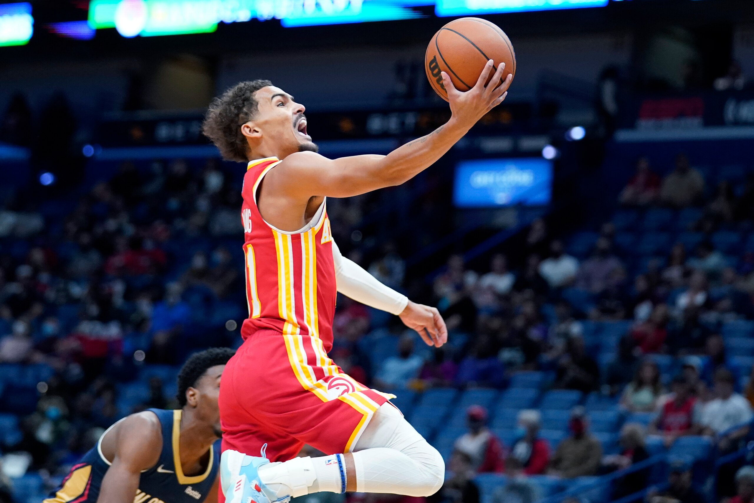 Atlanta Hawks guard Trae Young goes to the basket in the first half of an NBA basketball game against the New Orleans Pelicans in New Orleans, Wednesday, Oct. 27, 2021. (AP Photo/Gerald Herbert)